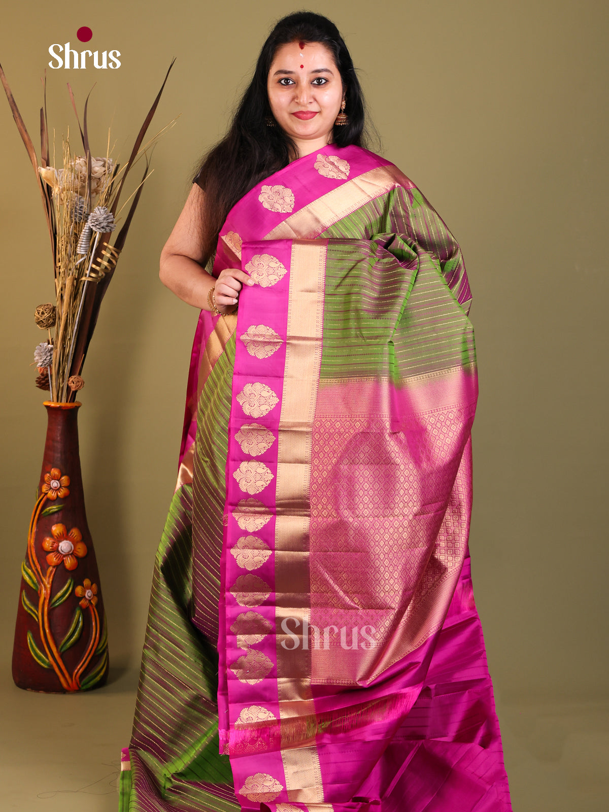 green and pink Kanchipuram Butta design Saree