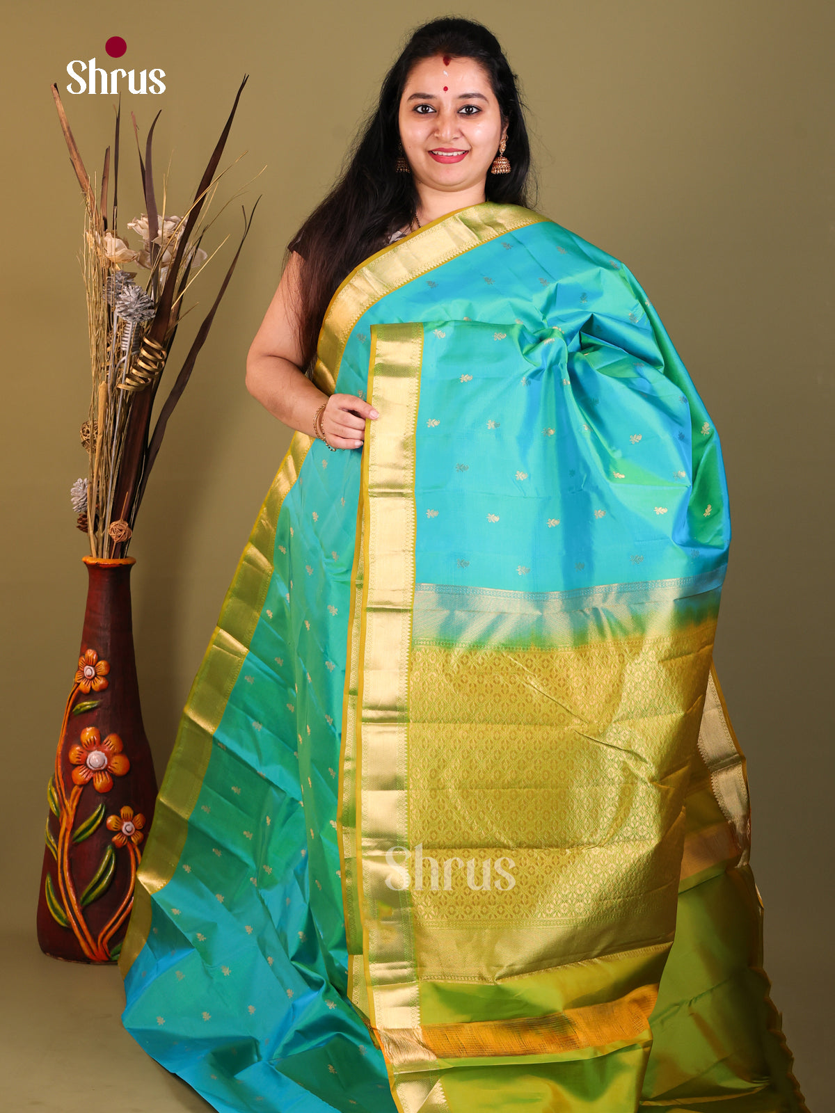 Blue and yellow Kanchipuram Butta design Saree