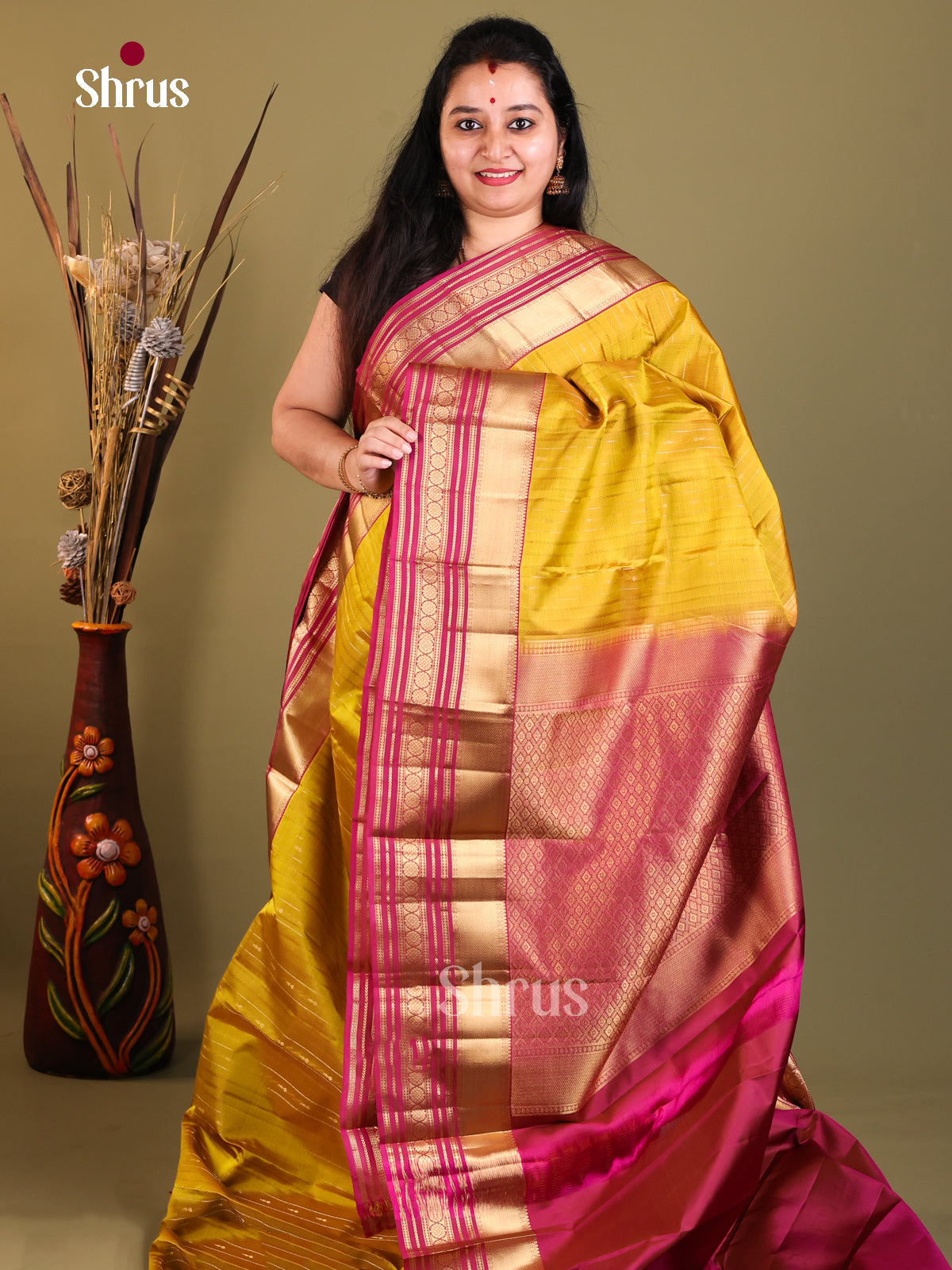 Mustard yellow and pink Kanchipuram Butta design Saree