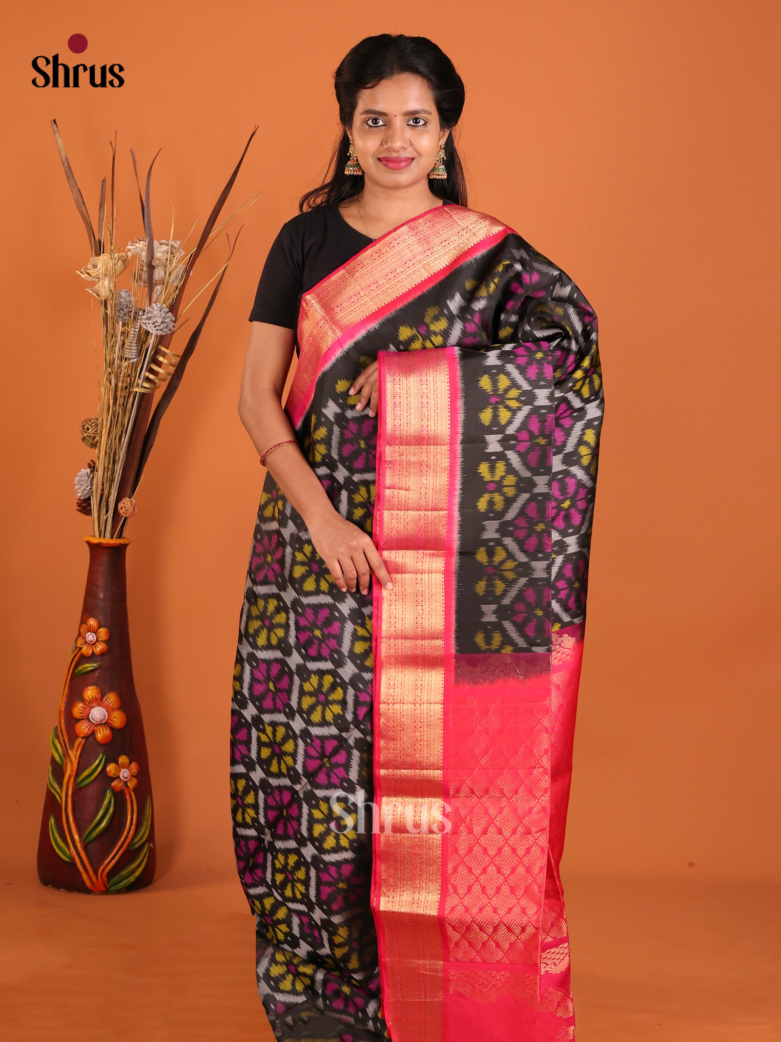 Captivating Black Soft Silk Saree With Ikat Pattern & Deep Pink Brocade Pallu