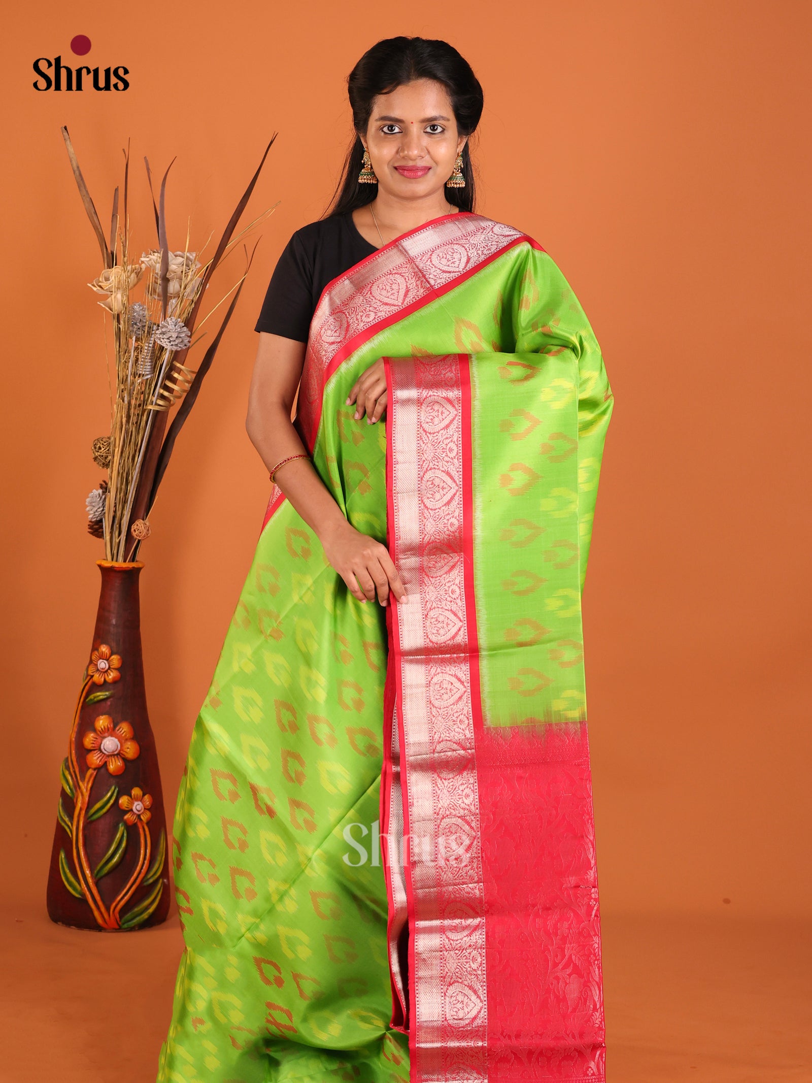 Striking Lime Green Soft Silk Saree With Ikkat Leaf Pattern & Red Zari Border