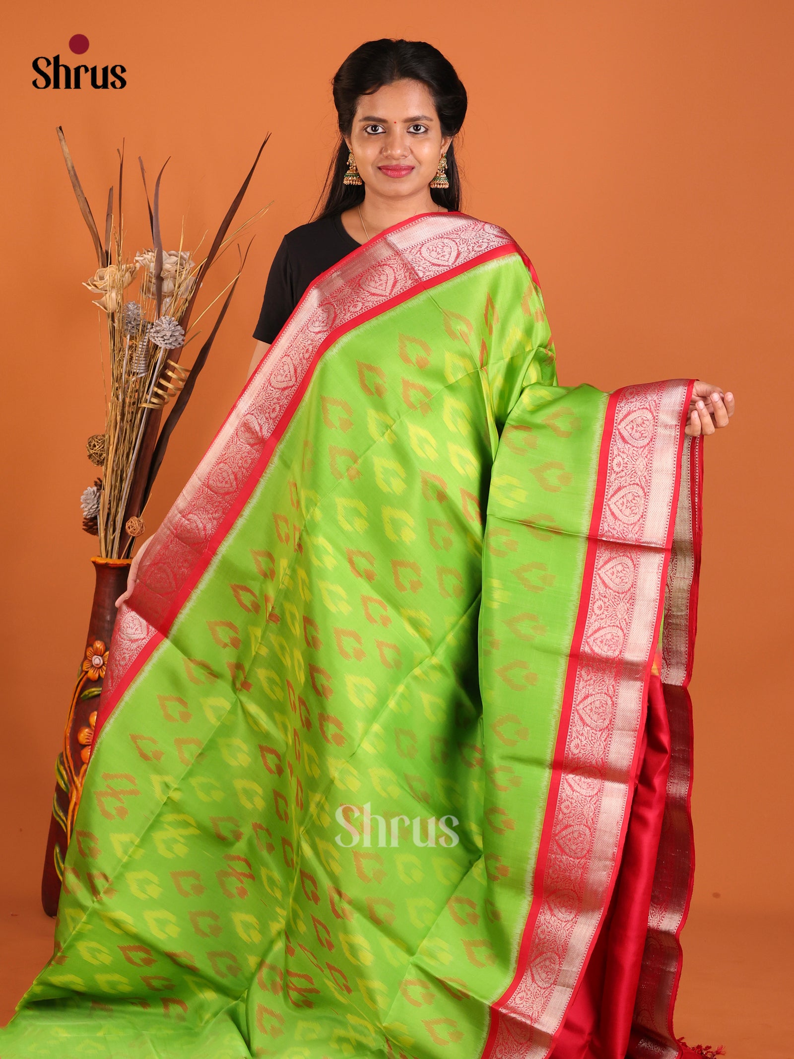 Striking Lime Green Soft Silk Saree With Ikkat Leaf Pattern & Red Zari Border 1