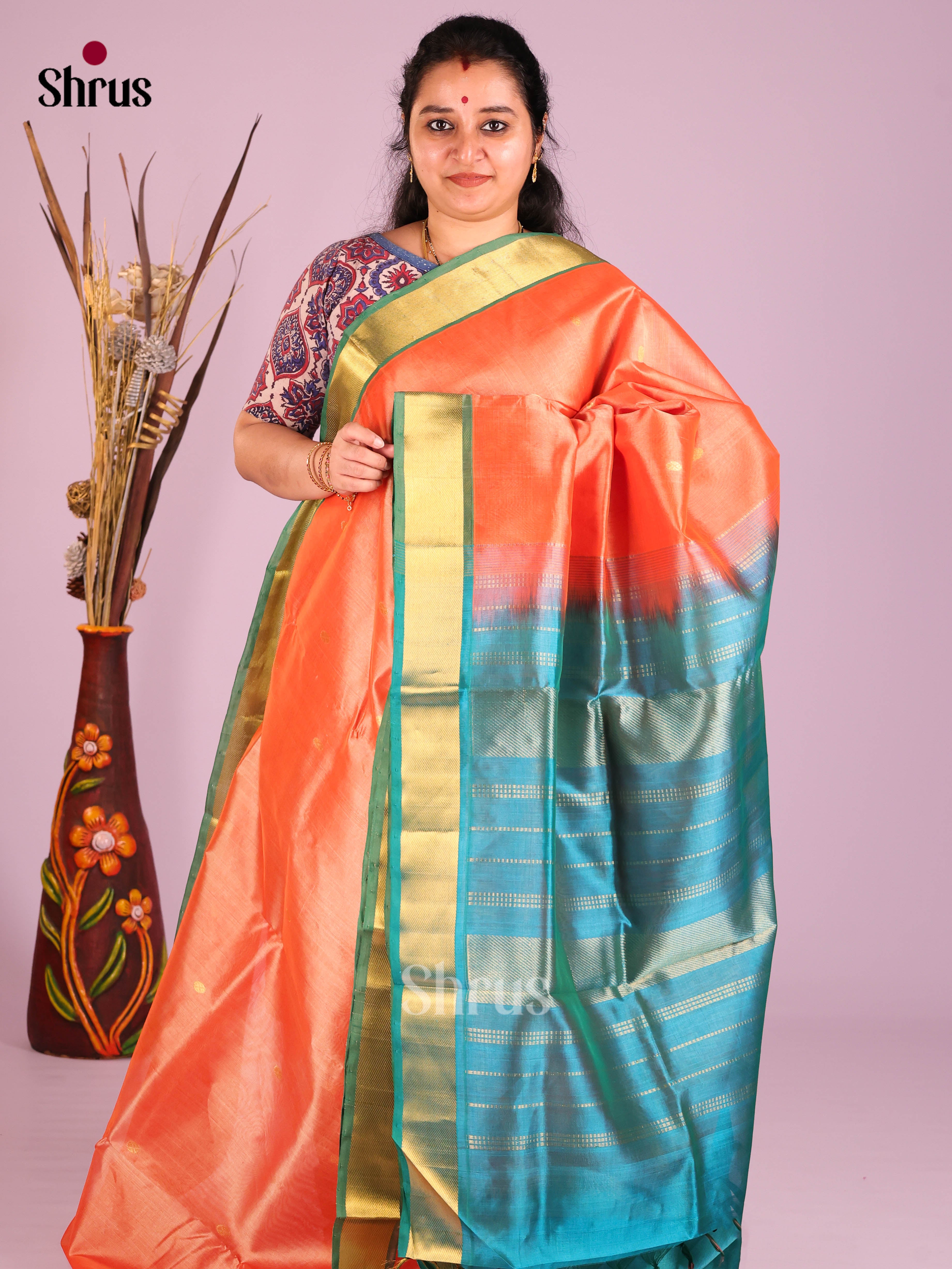 Ethereal Peach Silk Cotton saree With Zari Buttas & Blue Kaddi Border