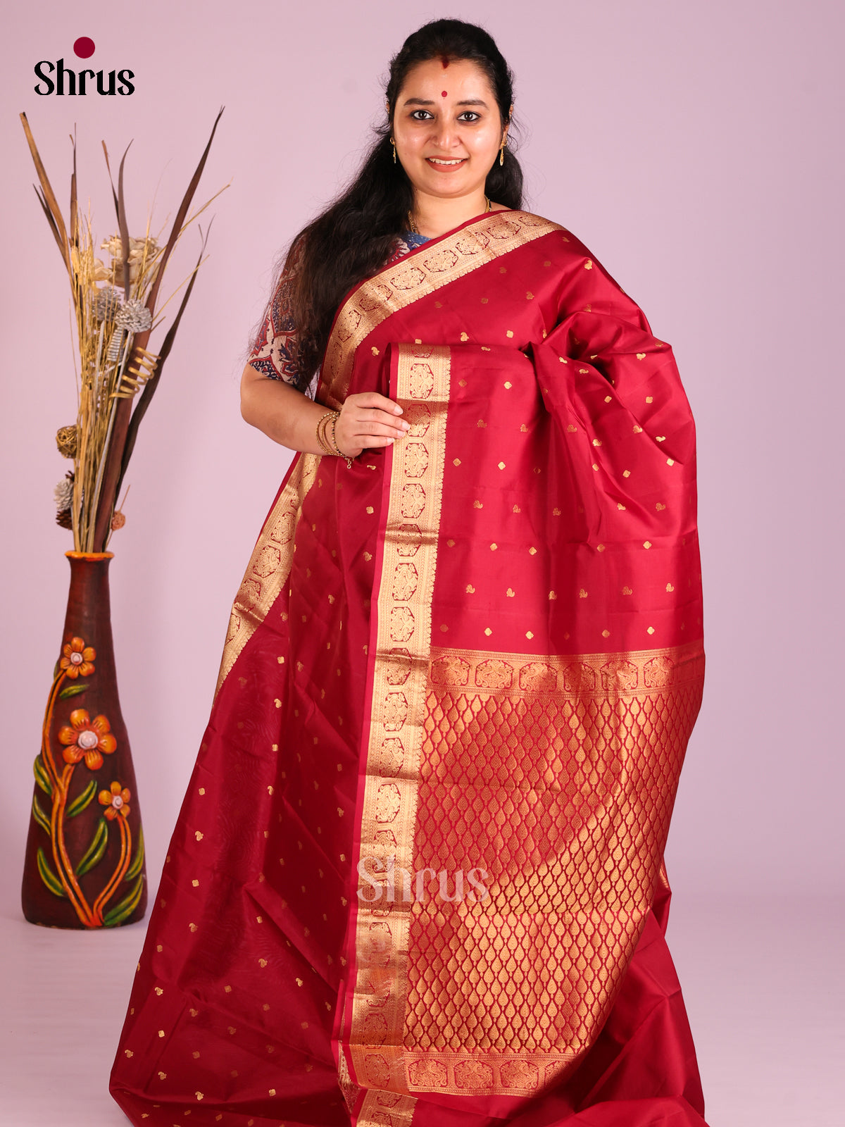 Maroon single tone Kanchipuram Butta design Saree with small zari buttas