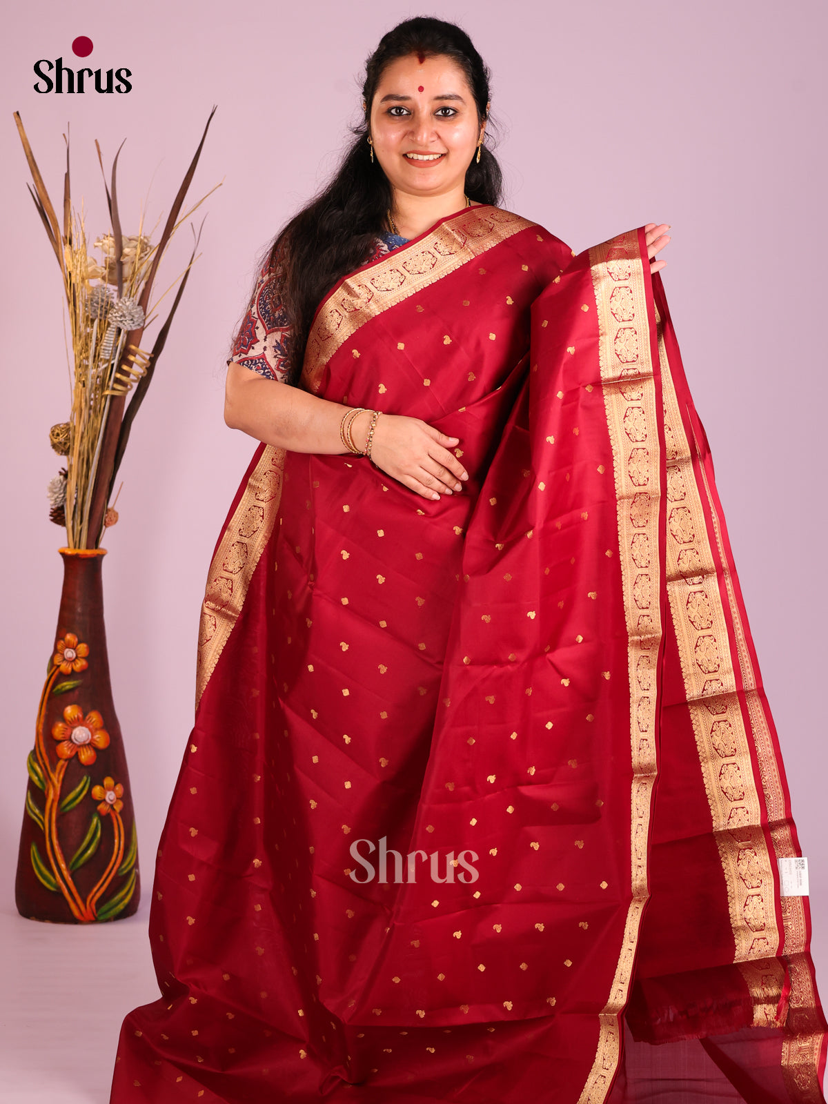 Maroon single tone Kanchipuram Butta design Saree with small zari buttas