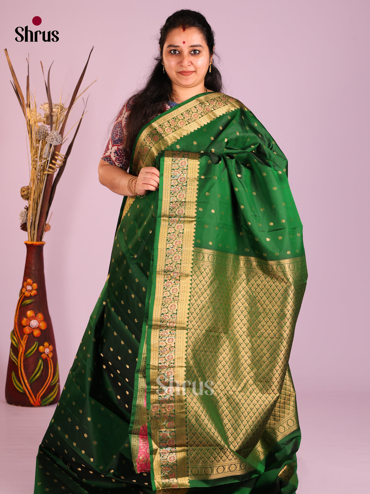 Green single tone Kanchipuram Butta design Saree with rich traditional zari border - Shop on Shrus.com