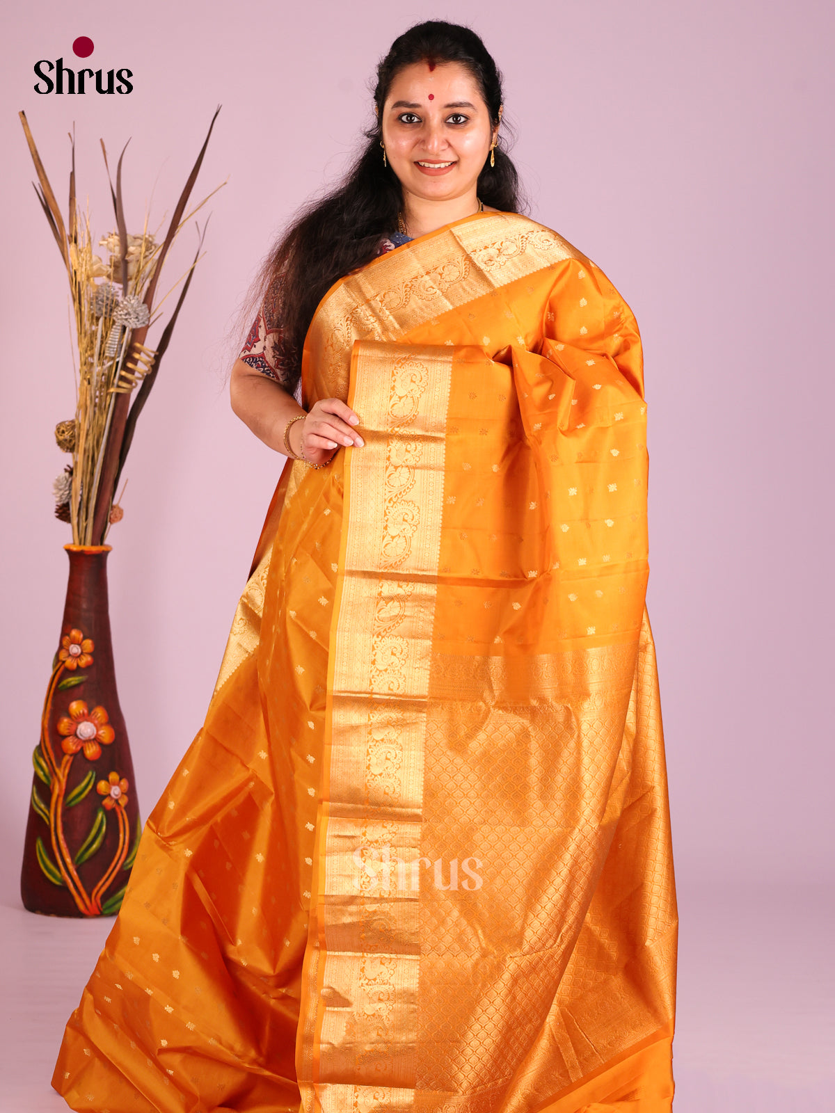 Orange single tone Kanchipuram Butta design Saree with rich traditional zari border - Shop on Shrus.com