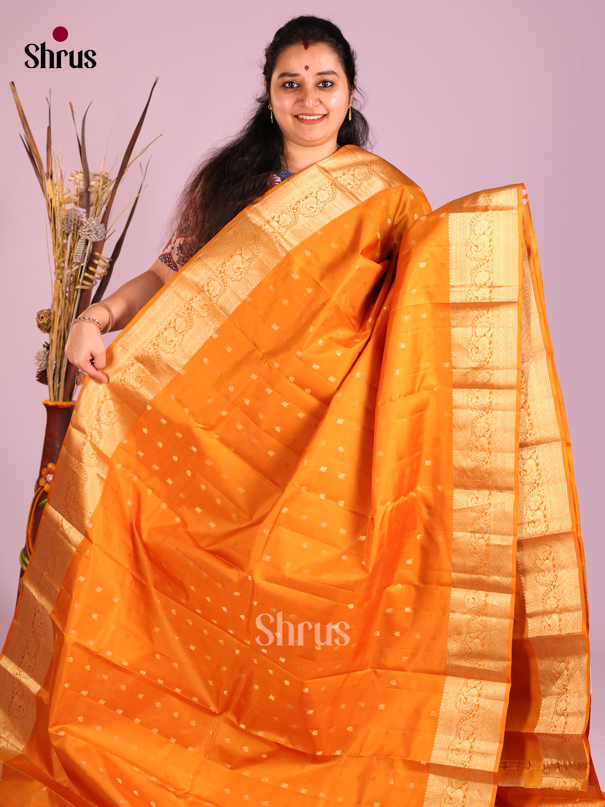 Orange single tone Kanchipuram Butta design Saree with rich traditional zari border - Shop on Shrus.com