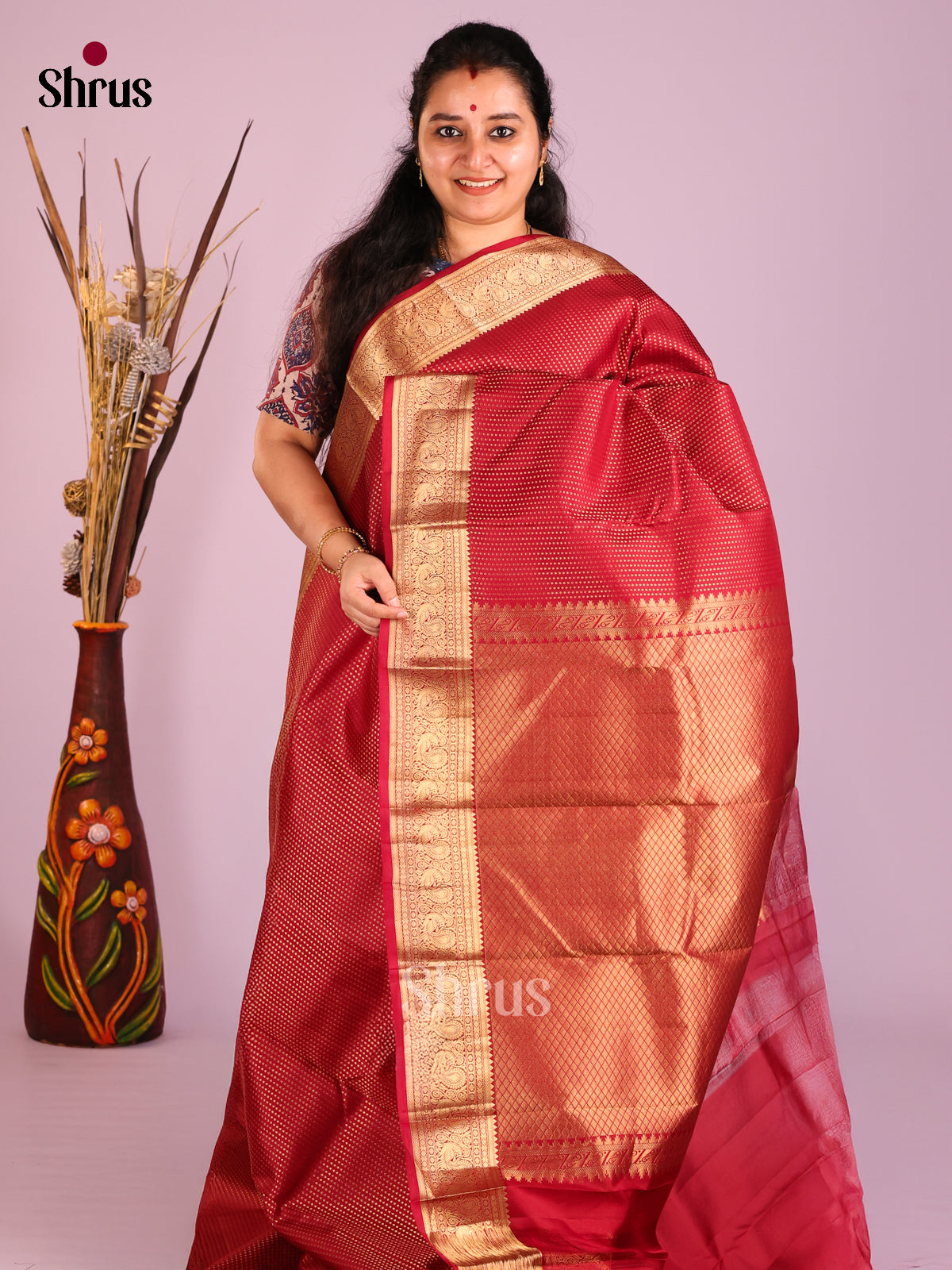 Maroon Single Tone Kanchipuram Butta design Saree with peacock vines zari border