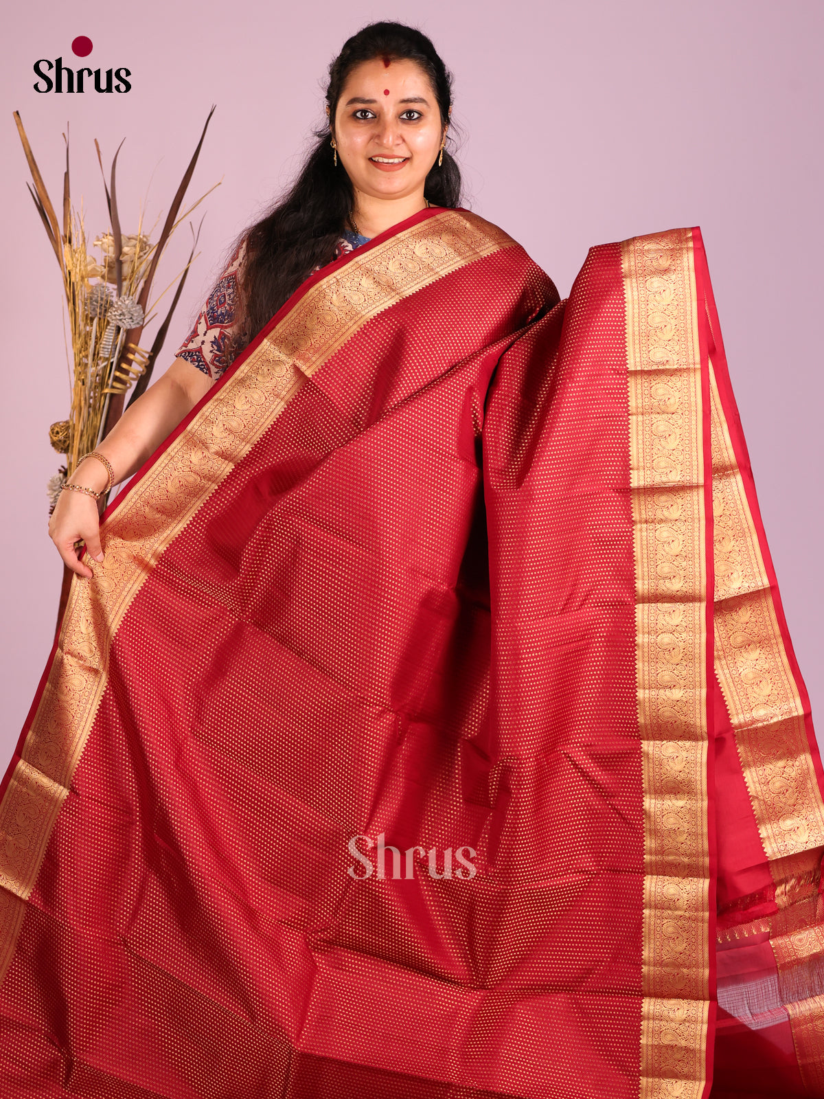 Maroon Single Tone Kanchipuram Butta design Saree with peacock vines zari border