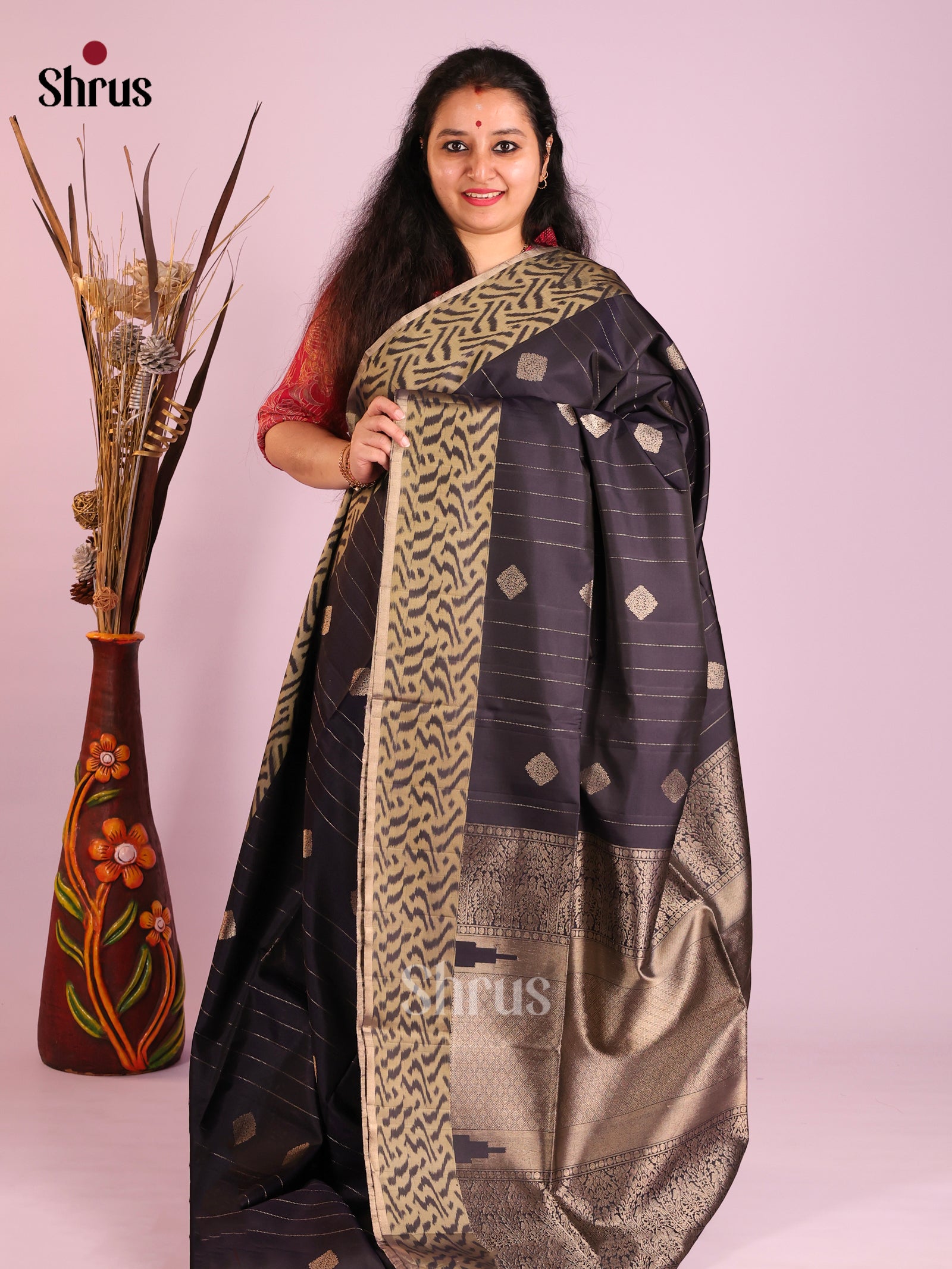 Exquisite Black Soft Silk Saree with gold zari Stripes, buttas & ikkat border