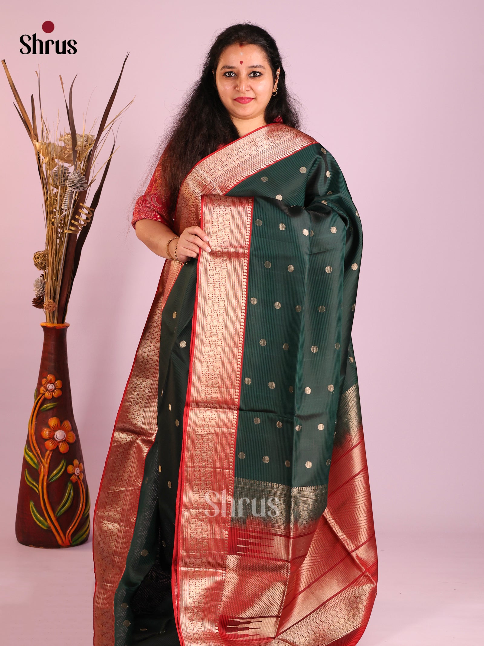 Classy Dark green Soft Silk Saree with zari buttas & rich Maroon border