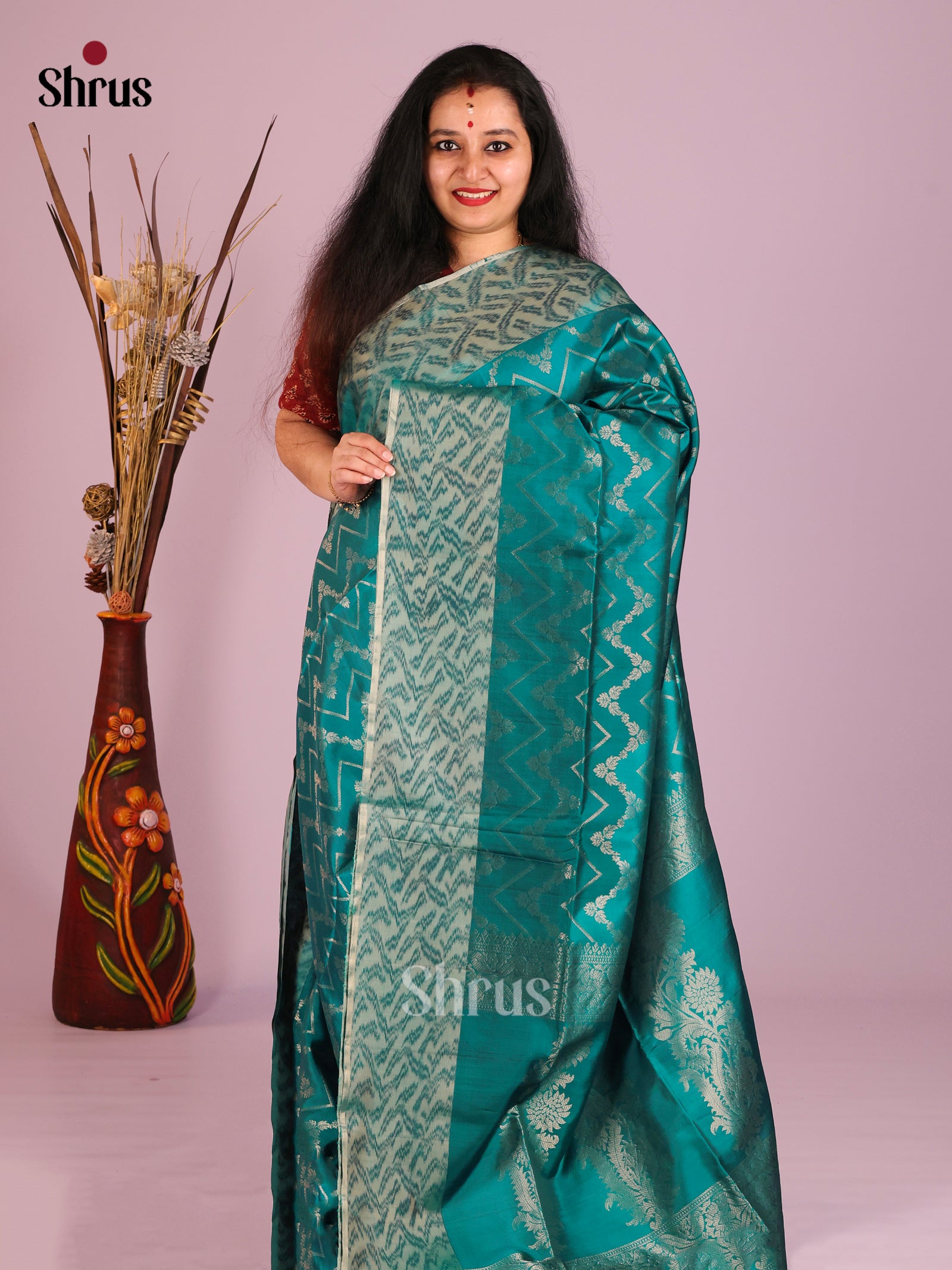 Exquisite Teal Soft Silk Saree With Zari woven Zig Zag Pattern