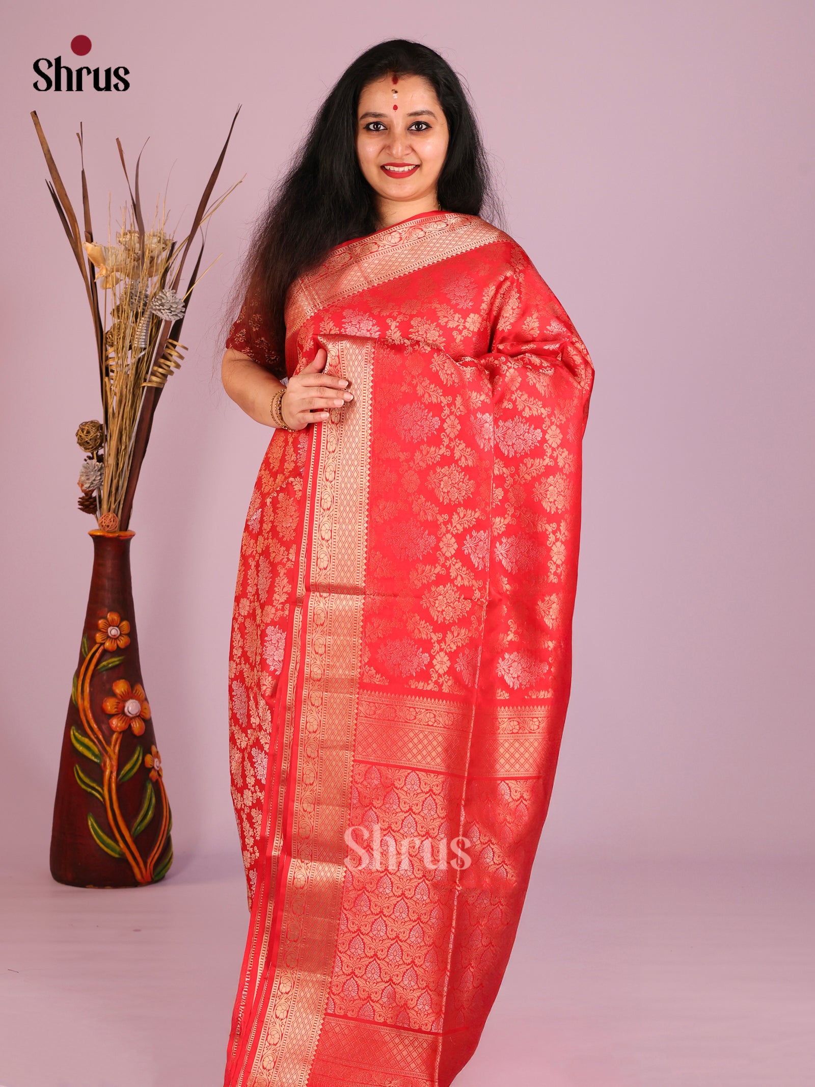 Exquisite Red Soft Silk saree with floral nestling brocade & Zari woven Border