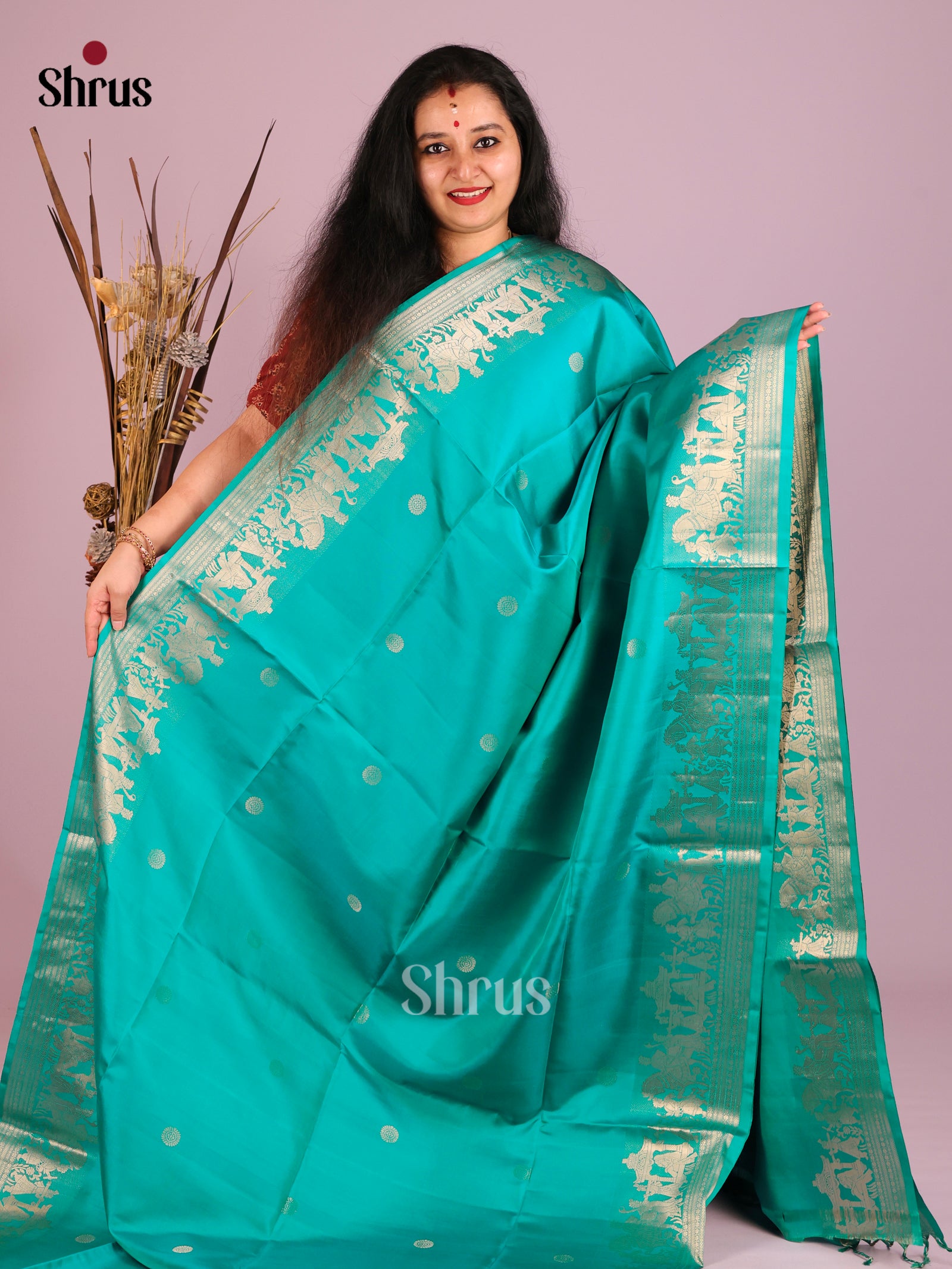 Exquisite Teal Soft Silk Saree with Zari Buttas & baraat themed border 1