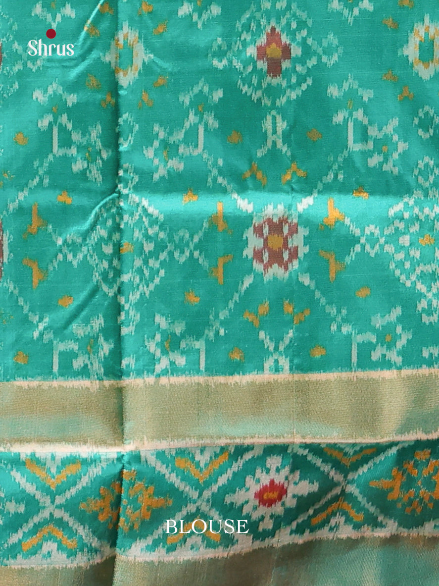 Opulent Green Ikkat Silk Saree With Elephant Motifs & Teal Zari Border