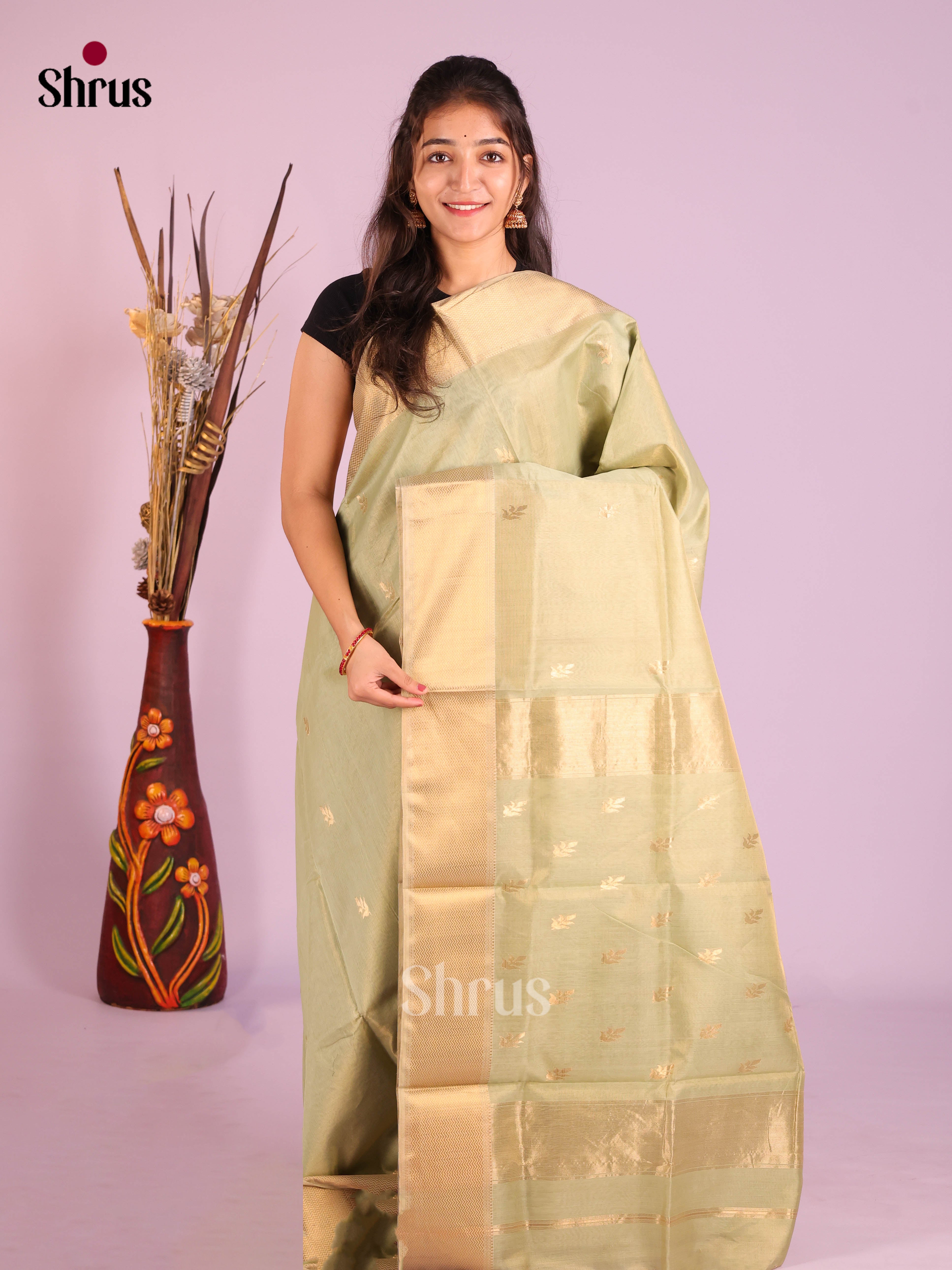 Exquisite Pastel Green Maheshwari silk cotton Saree With Gold Buttas & Zari Border