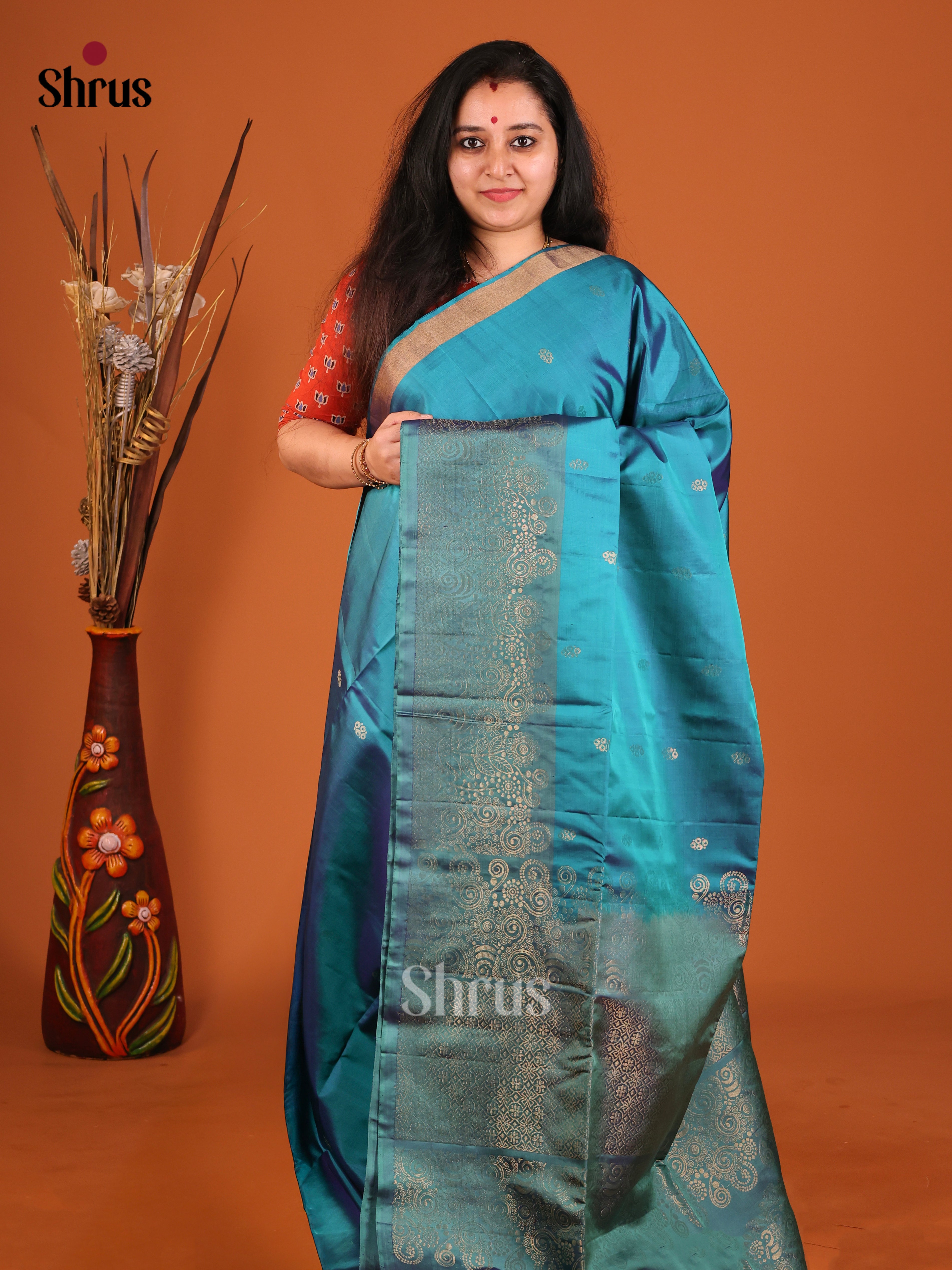 Vibrant Blue Soft Silk Saree with Gold Buttas & Floral zari brocade border