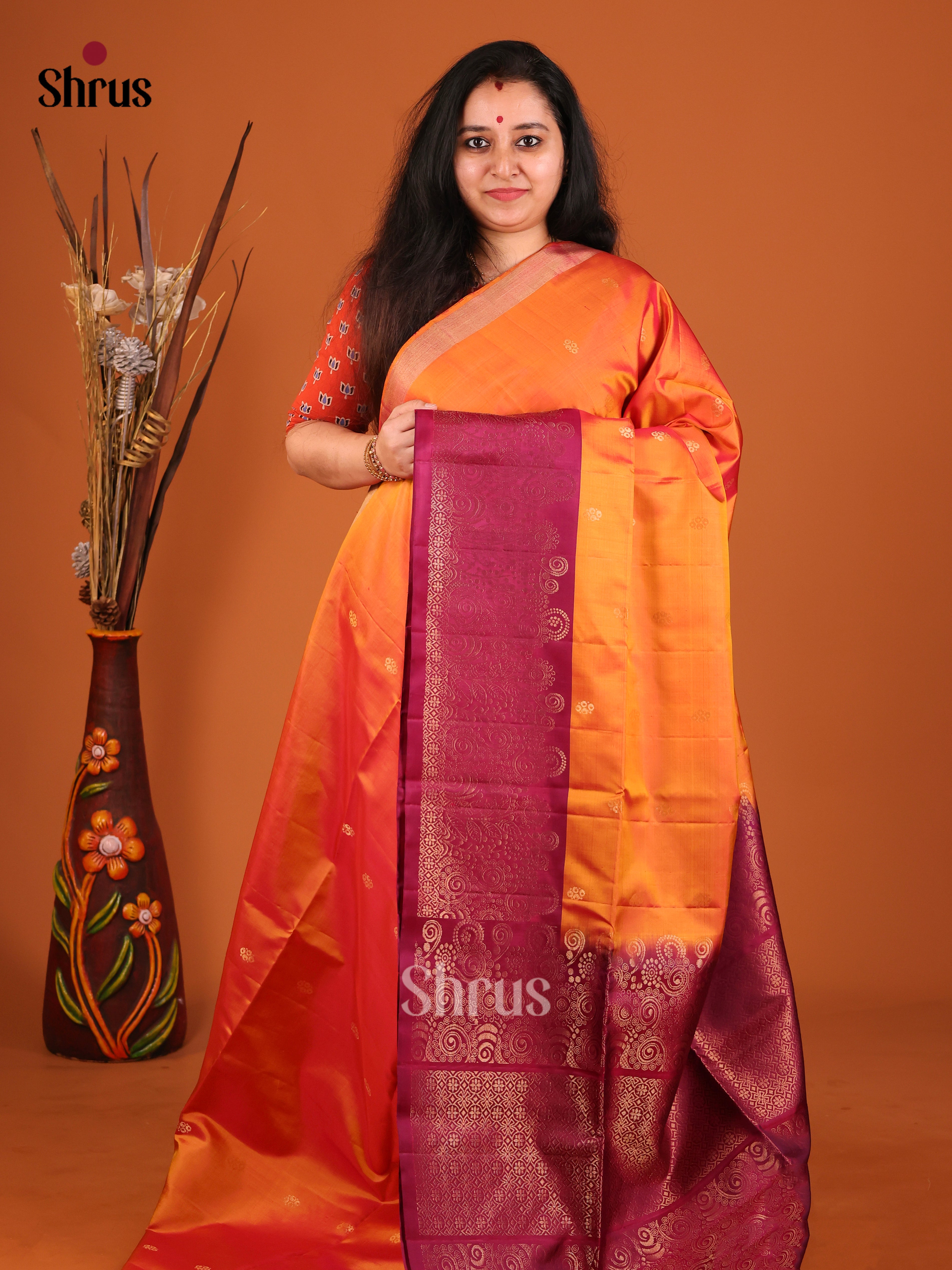 Radiant Orange Soft Silk Saree with gold floral buttas & MAroon Brocade Pallu
