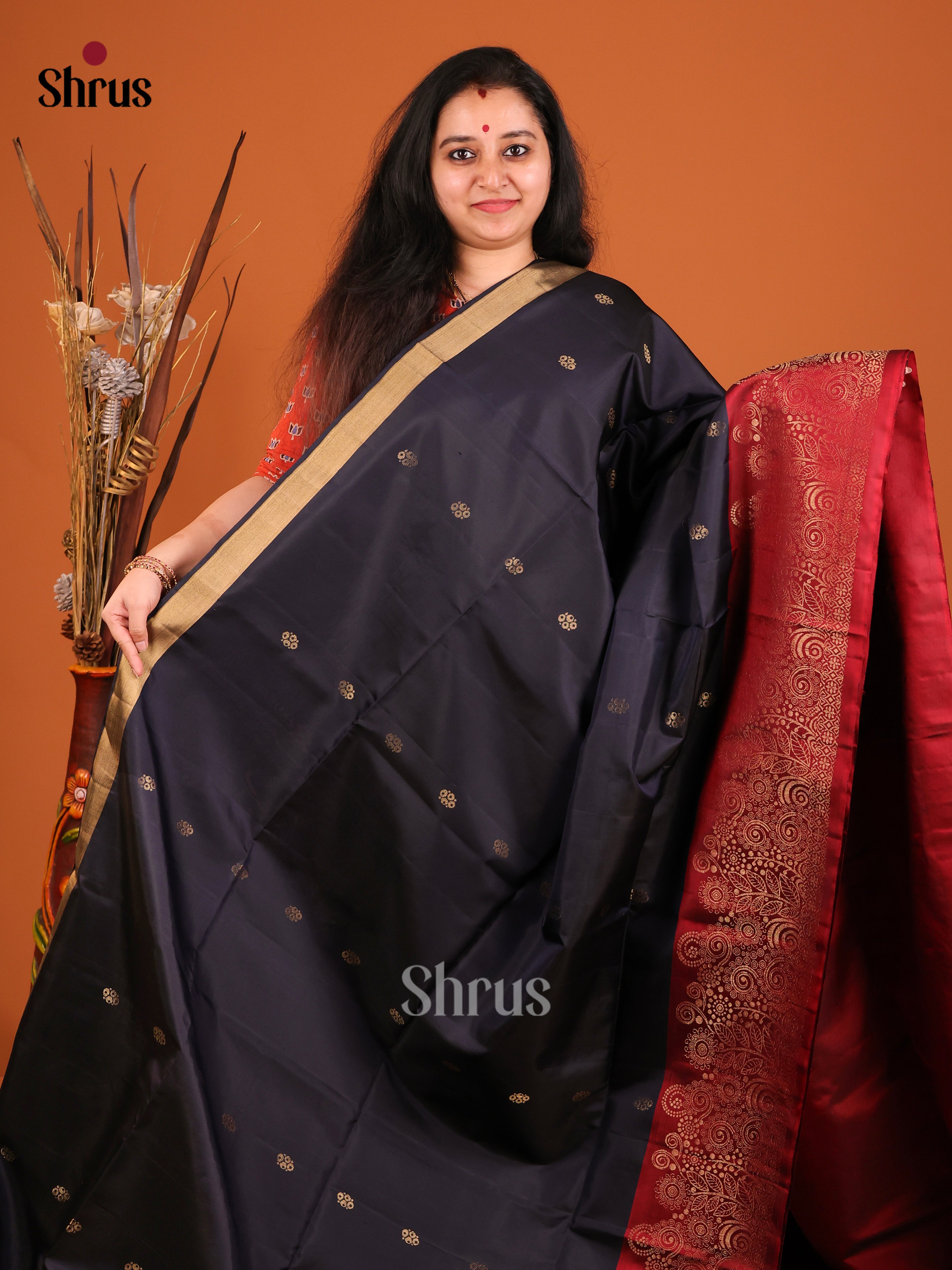 Blue & Maroon Soft Silk Saree gleams with gold zari floral buttas