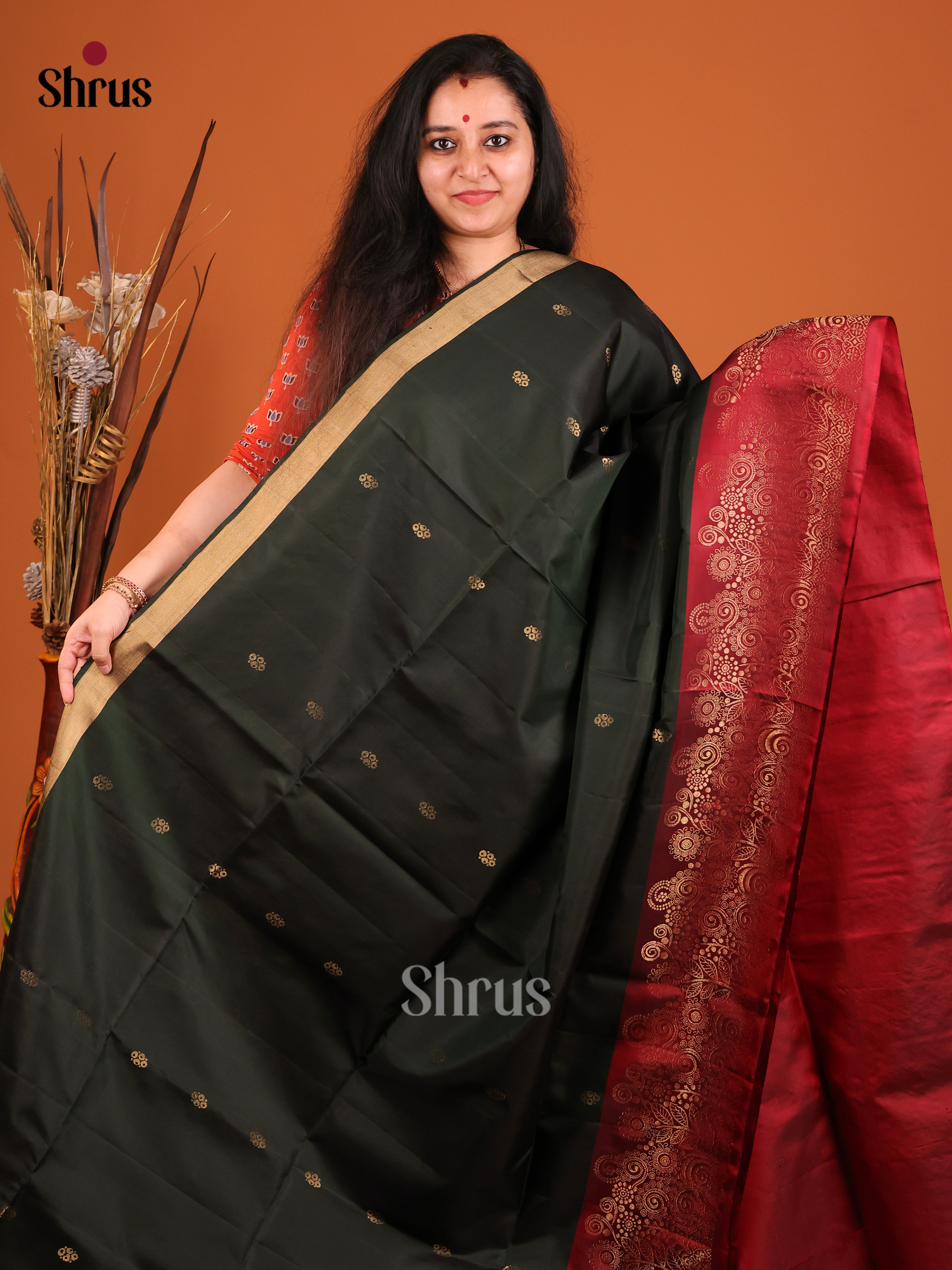 Stunning Dark Green Soft Silk Saree adorned with Gold Buttas & Maroon brocade border 1