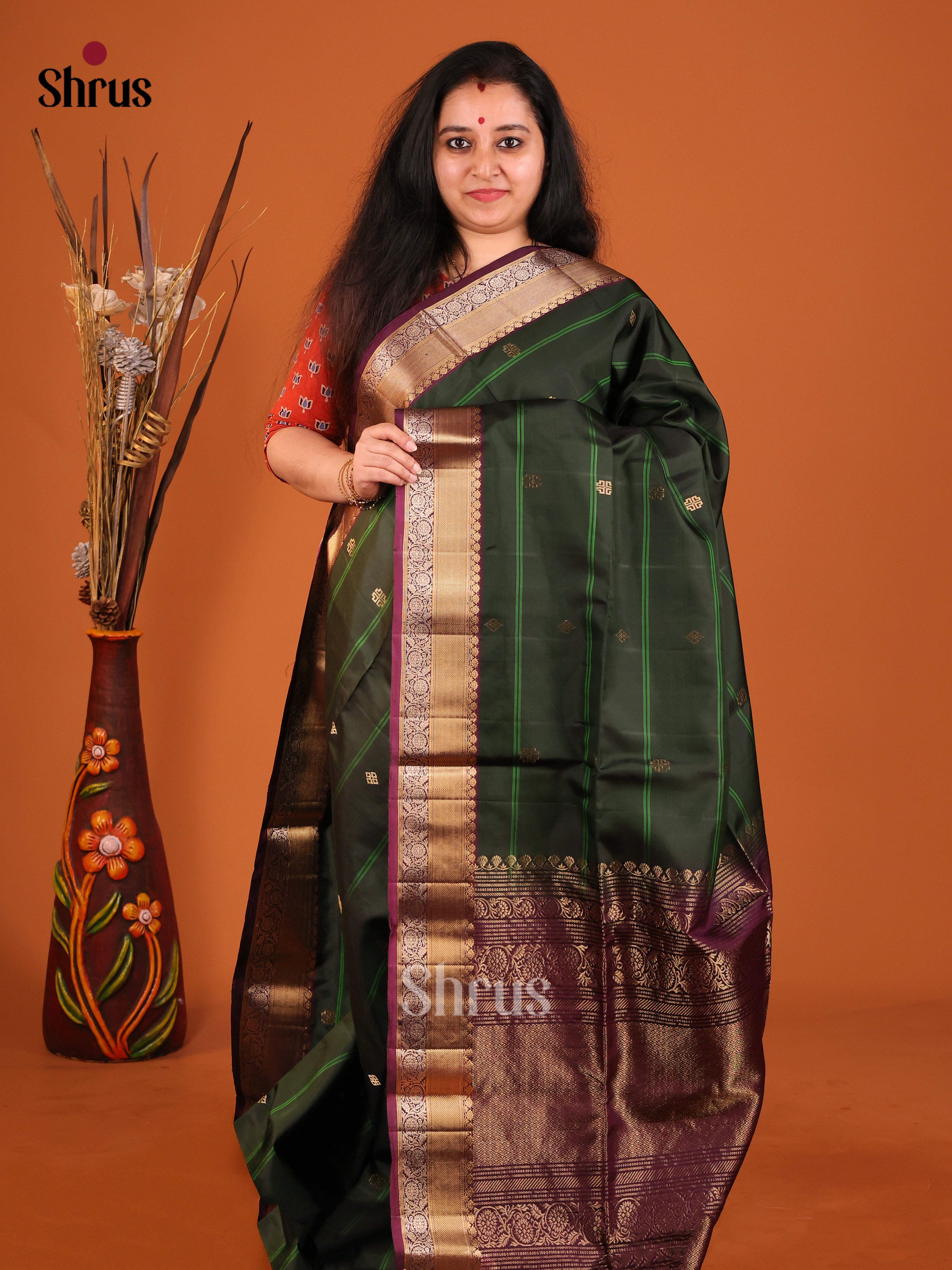 Opulent Green Soft Silk Saree with gold zari buttas, stripes & Maroon Brocade Pallu