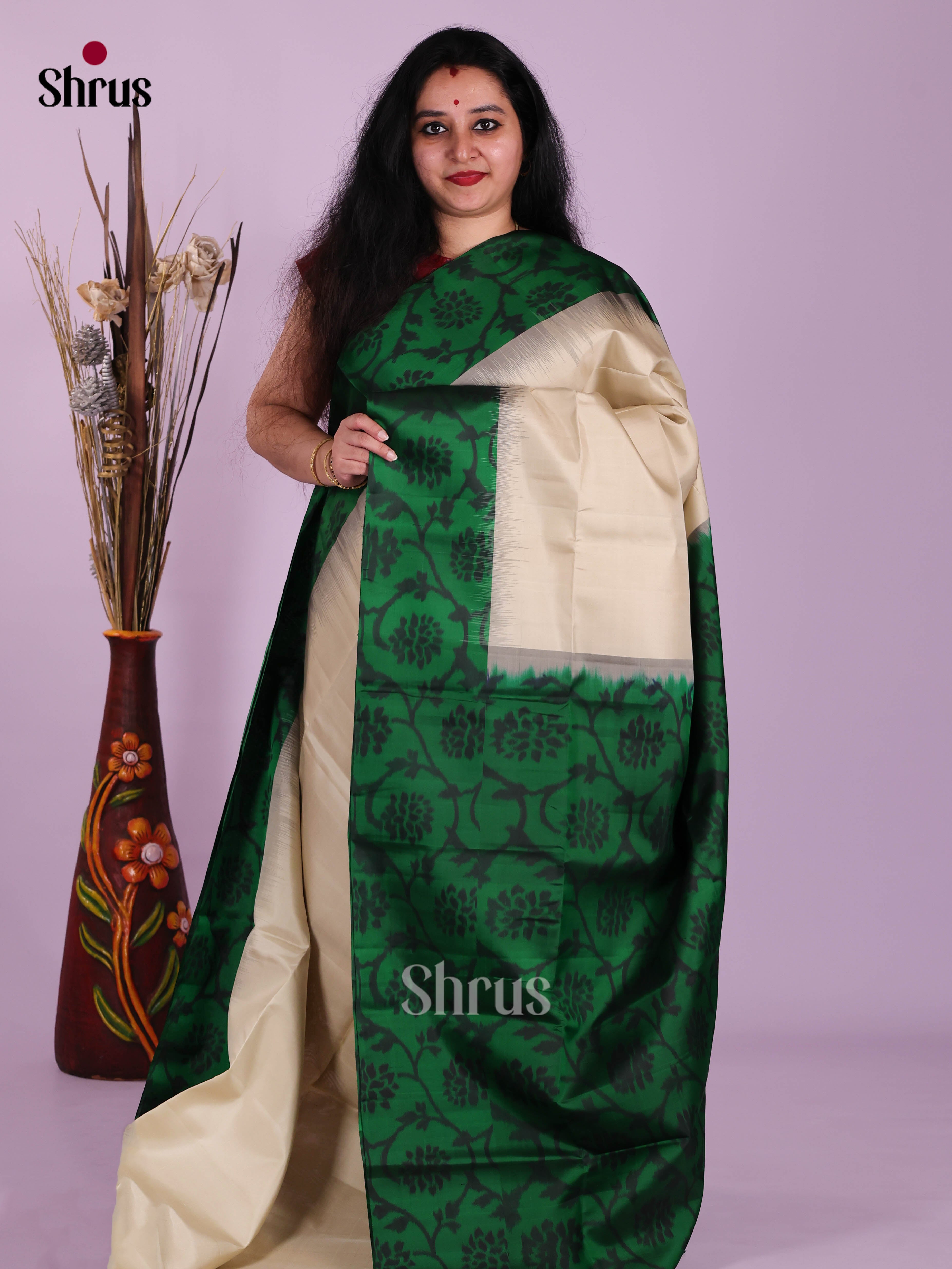Timeless Cream Soft Silk Saree With Plain Body & Green Border With Floral Pattern