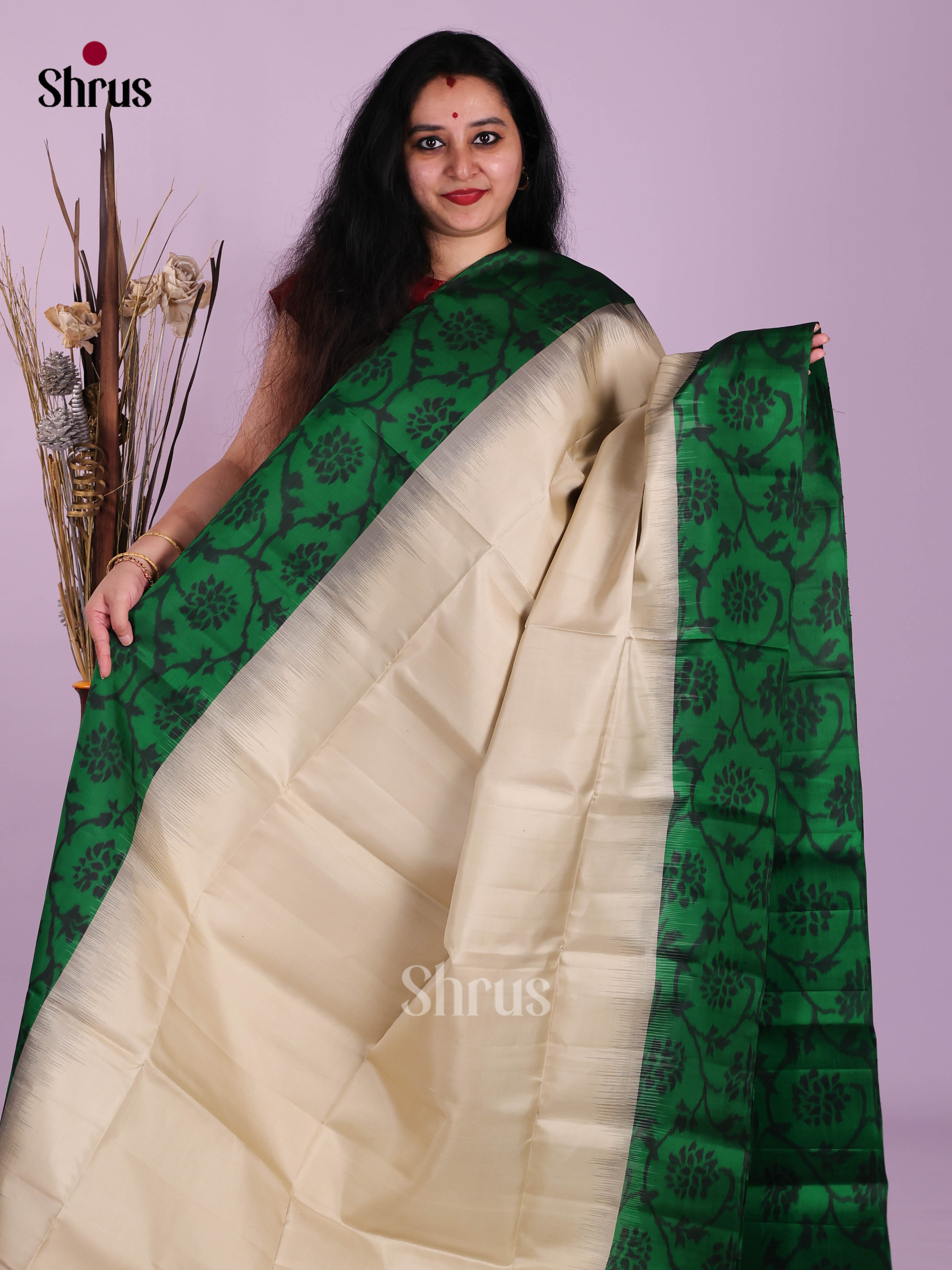 Timeless Cream Soft Silk Saree With Plain Body & Green Border With Floral Pattern