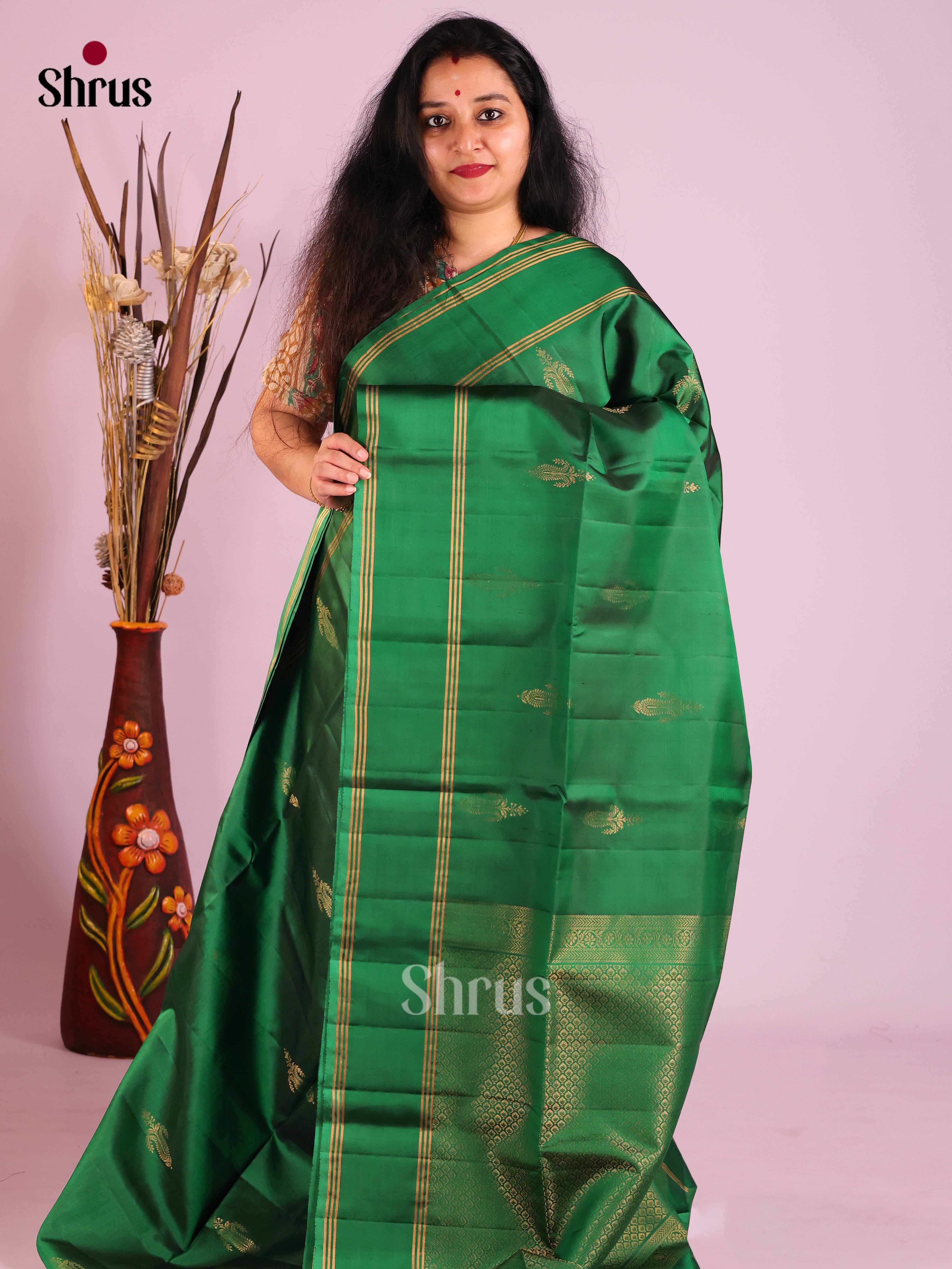 Classy Green Soft Silk Saree with gold floral motifs & Rettaipet Zari Border