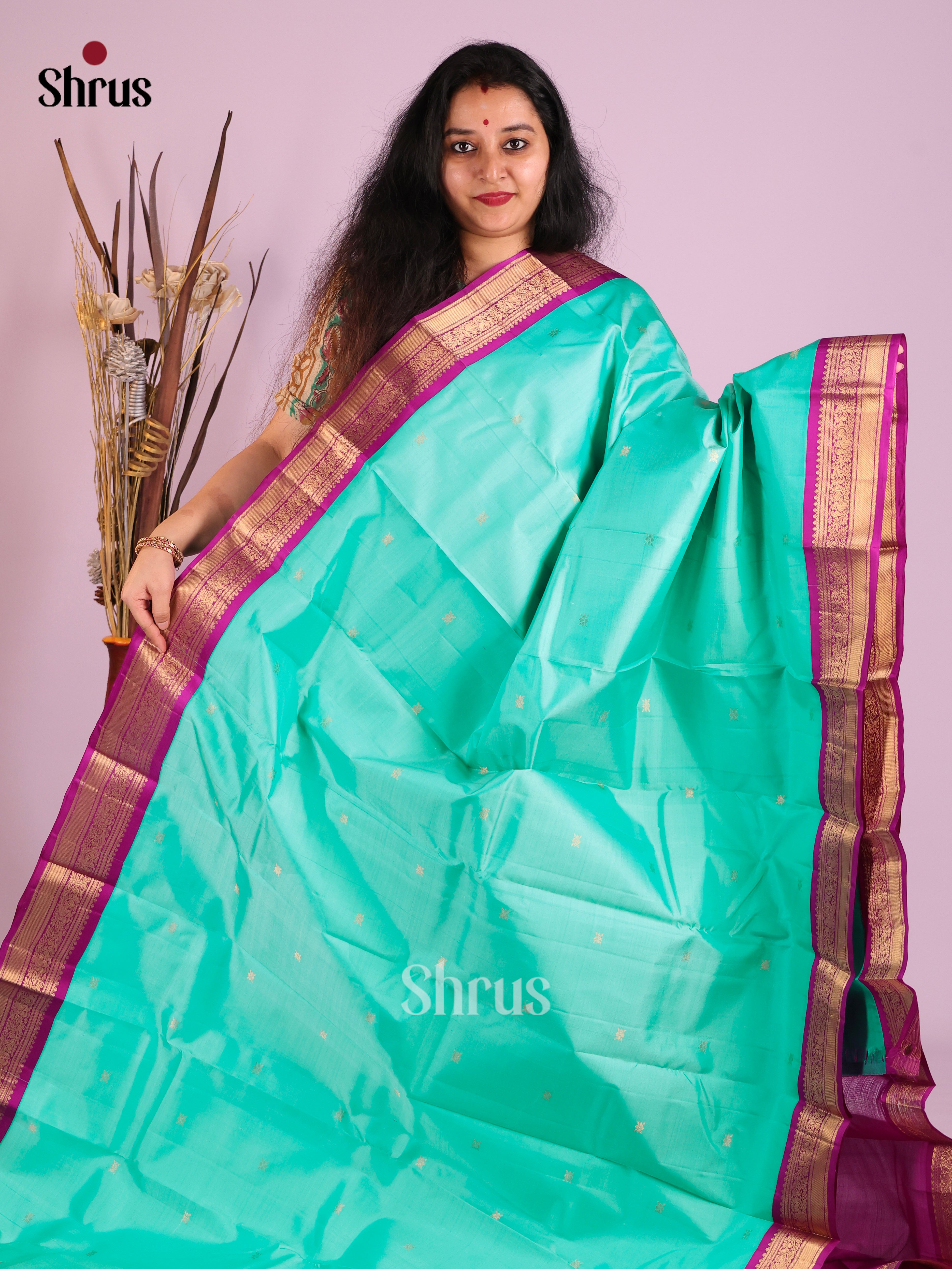 Opulent Teal Kanjivaram Saree with zari floral buttas & Purple Brocade Pallu 1