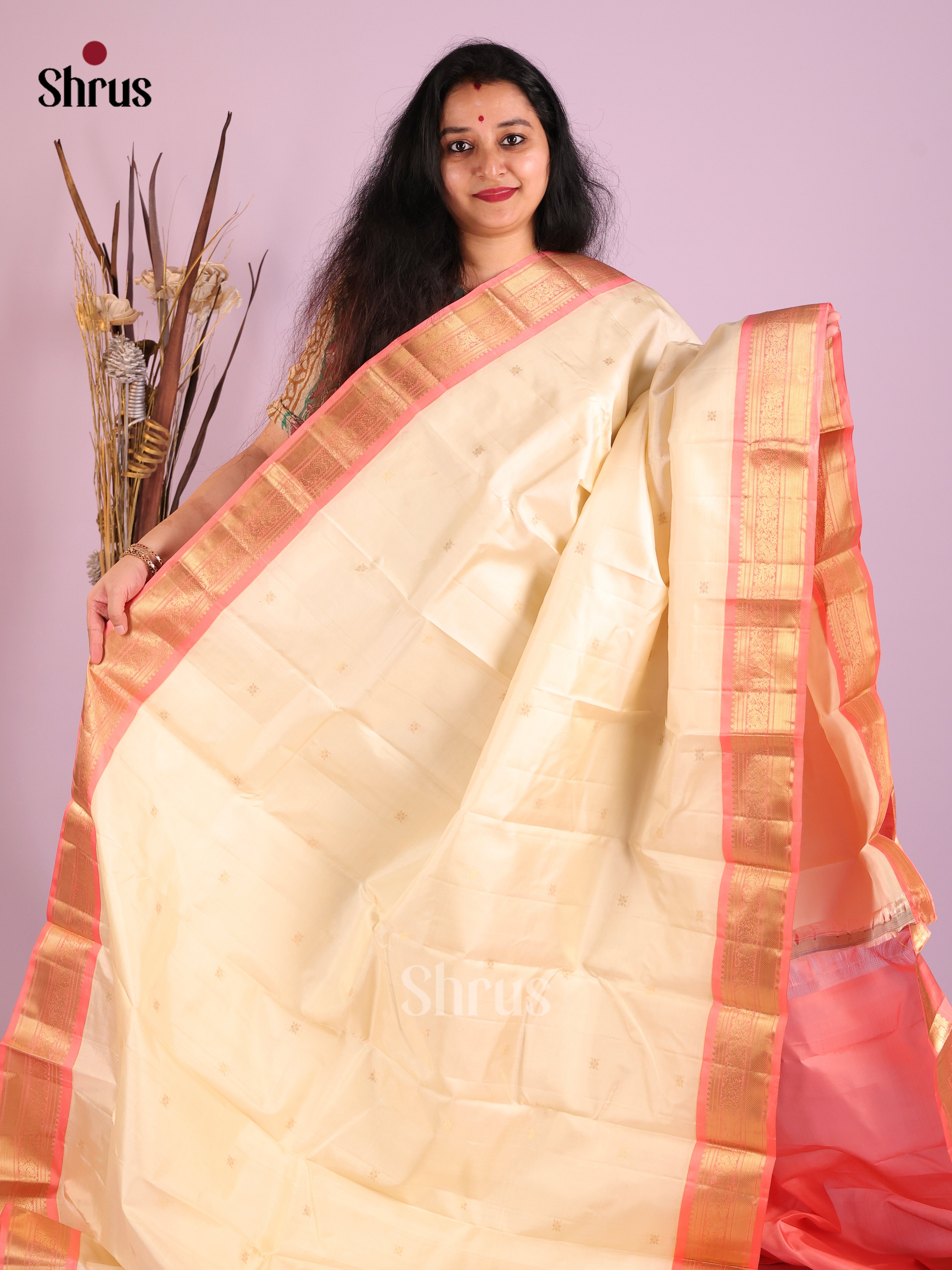 Shimmery Cream Kanjivaram Saree with zari buttas & Peachish Pink Brocade Pallu