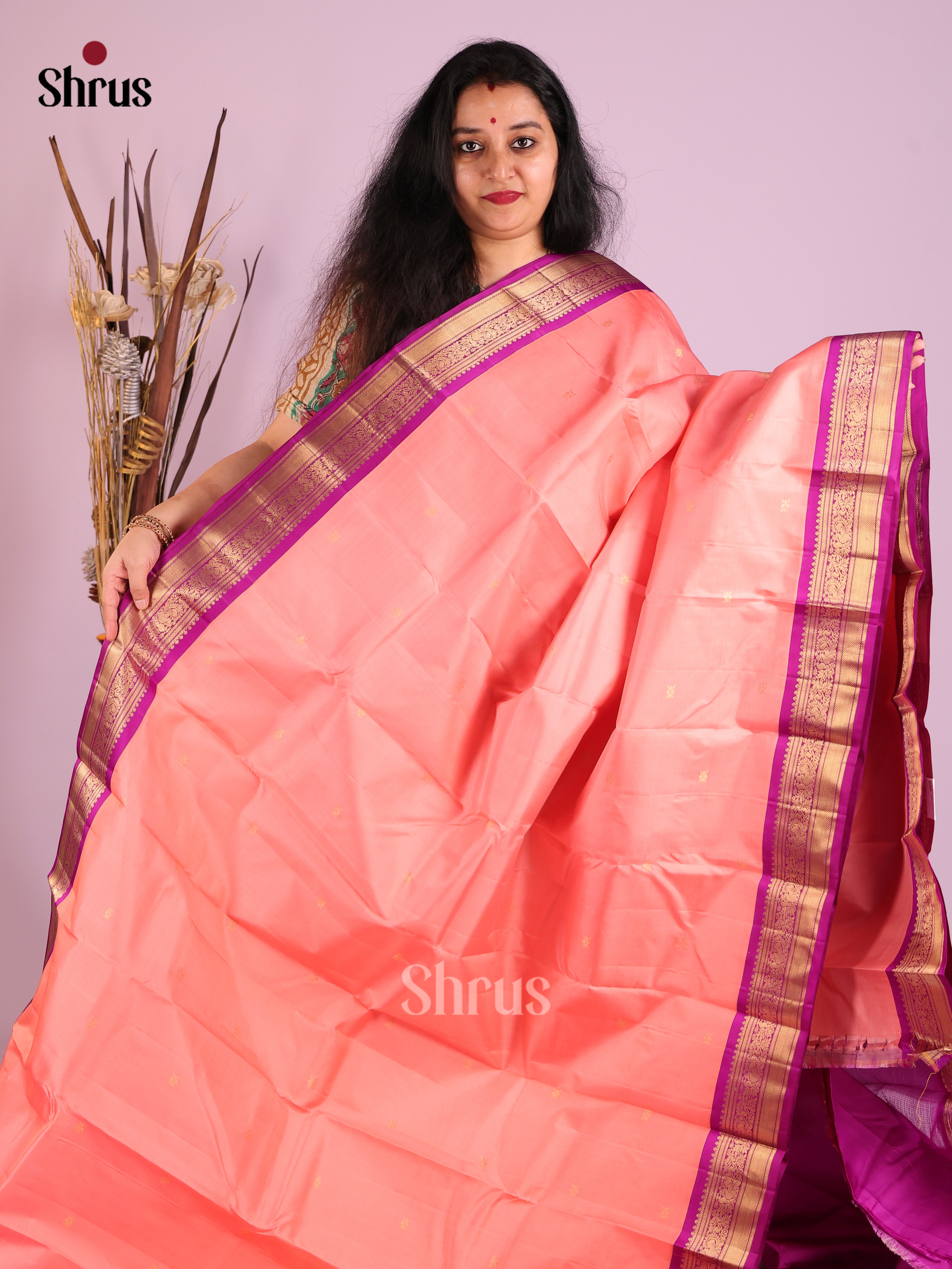 Radiant Peach Kanjivaram Saree with gold floral buttas & Purple Brocade Pallu 1