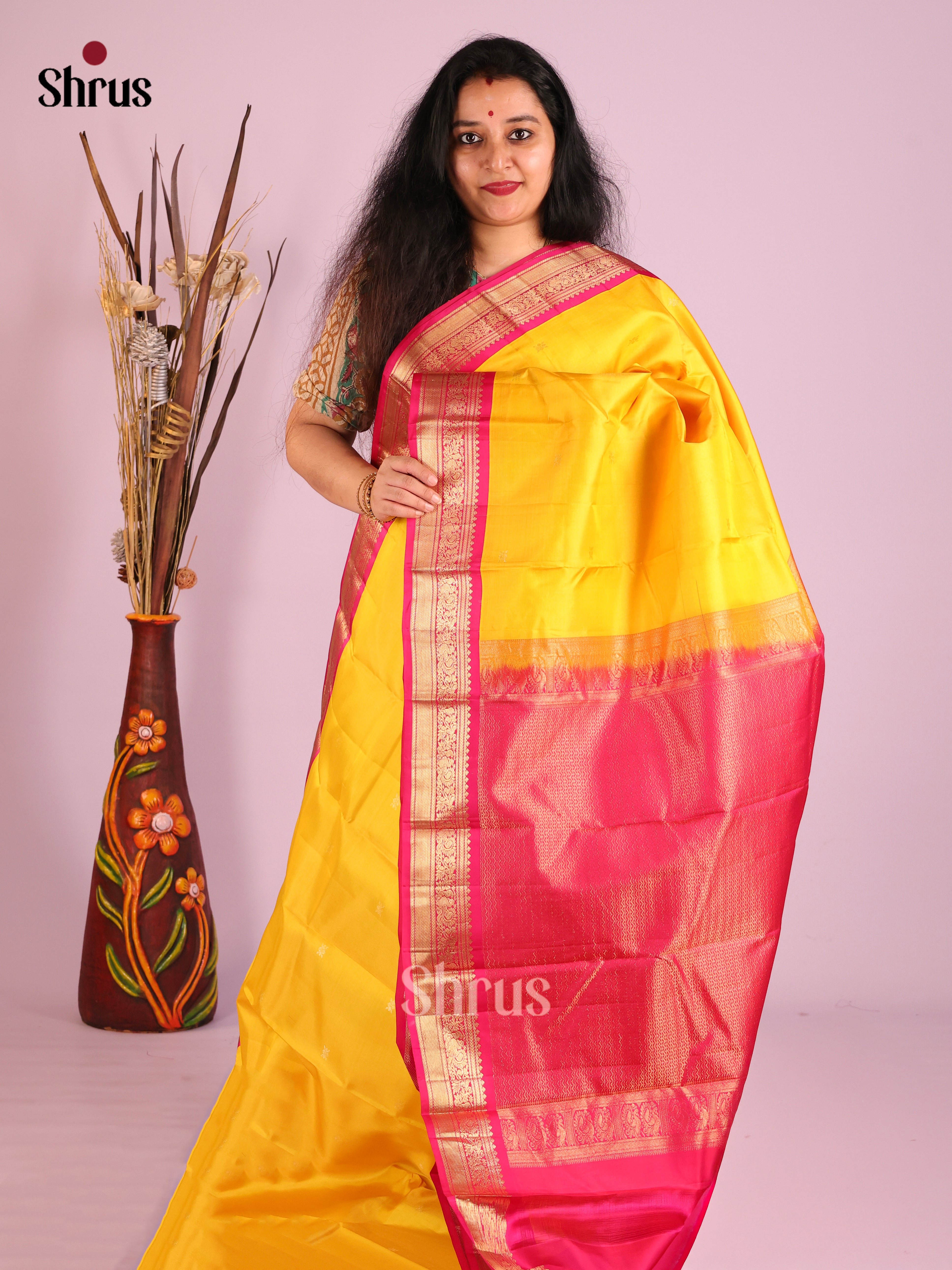 Charming Yellow Kanjivaram Saree with Golden Buttas & Red zari brocade pallu