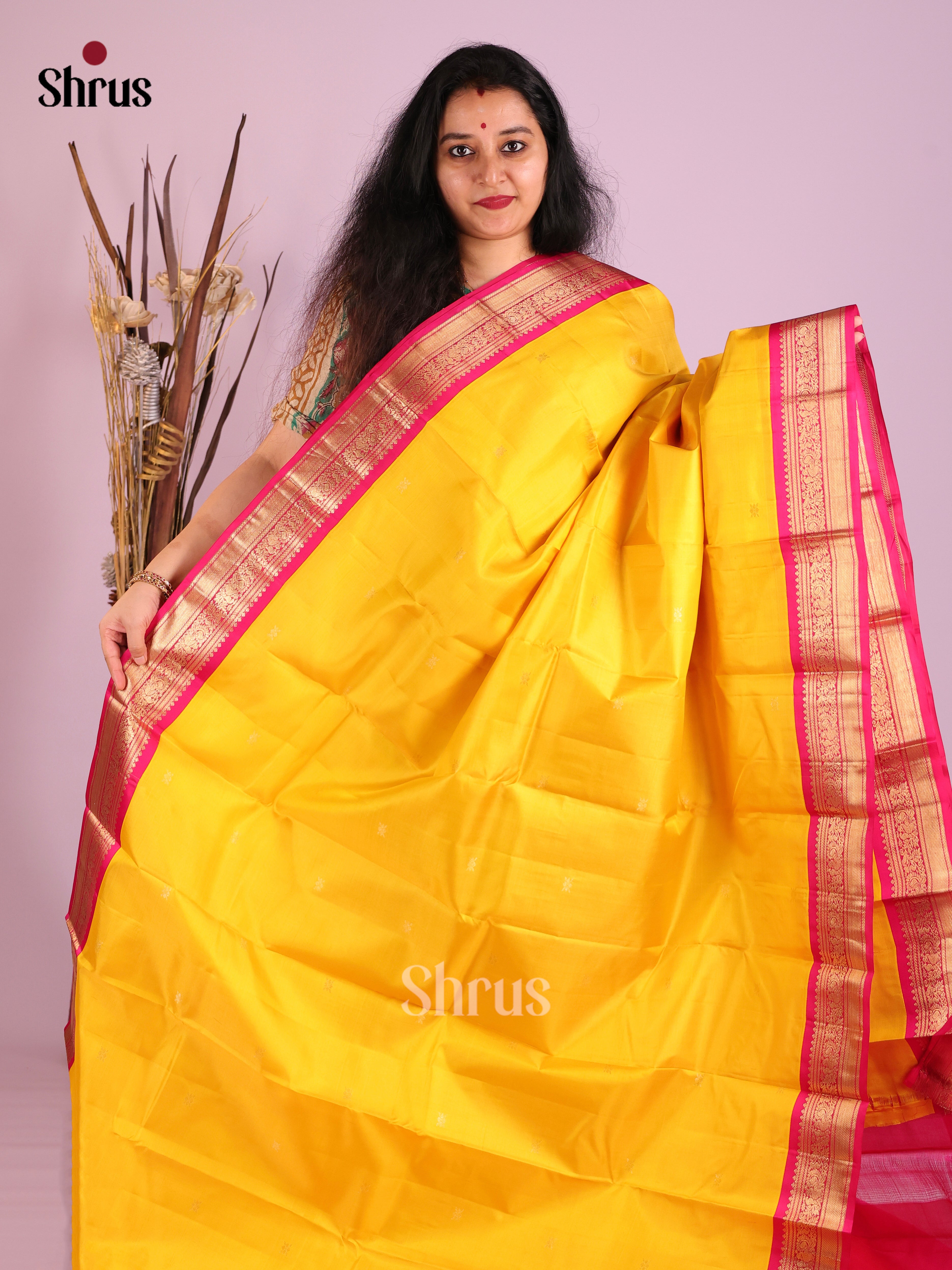 Charming Yellow Kanjivaram Saree with Golden Buttas & Red zari brocade pallu 1