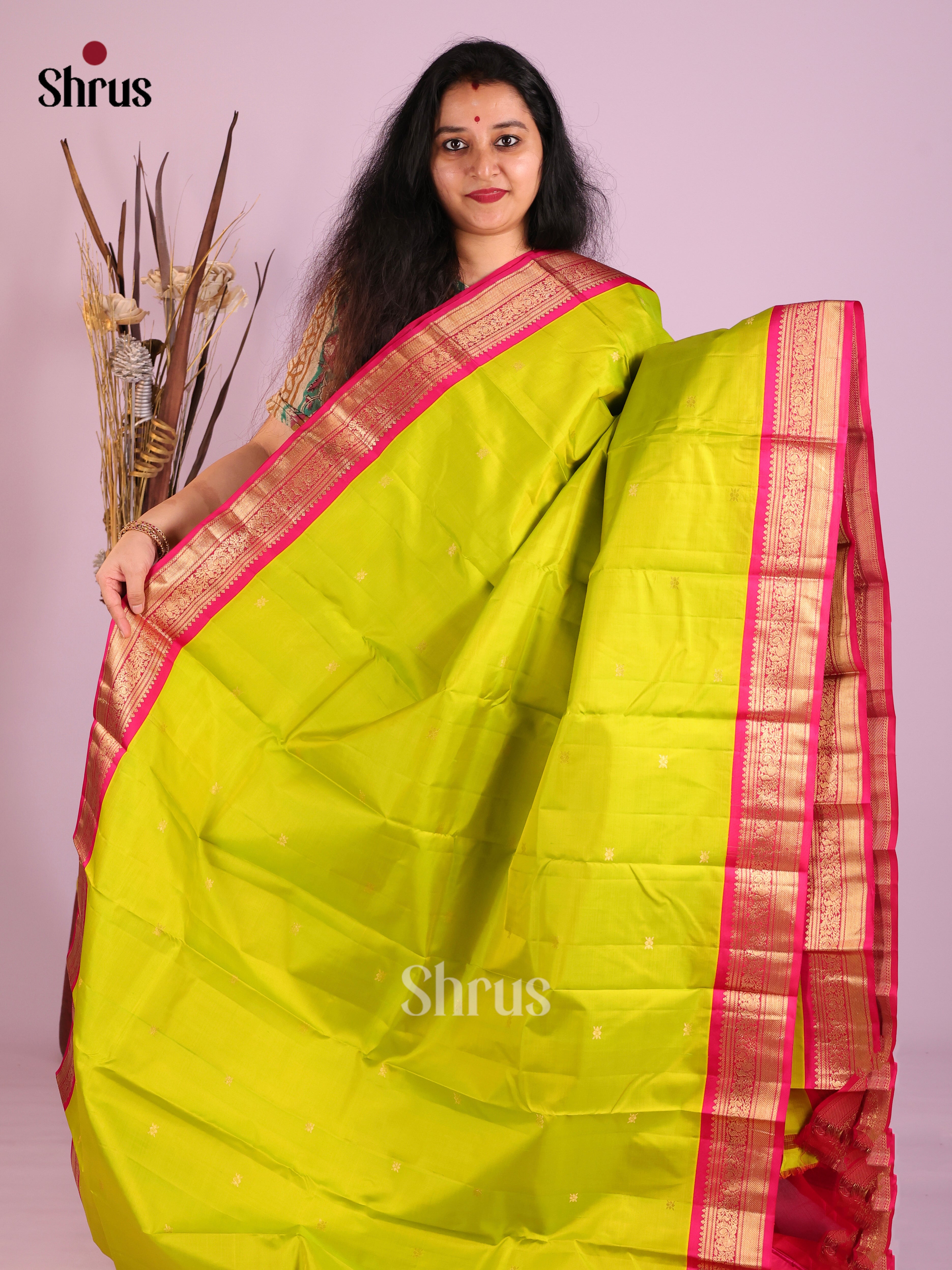 Exquisite Lime Green Kanjivaram Saree with Buttas & Pink peacock vines zari border 1