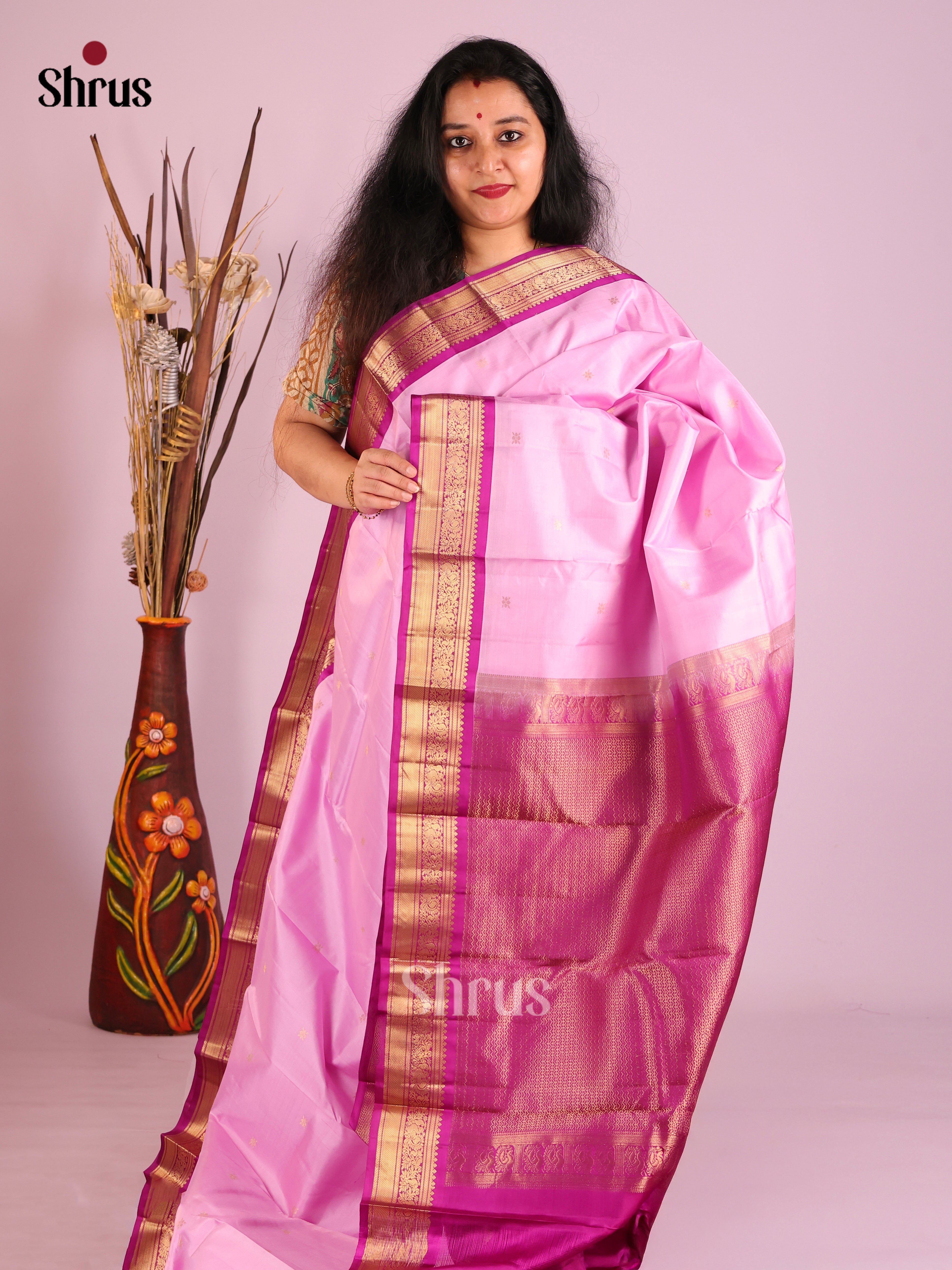 Gorgeous Baby Pink Kanjivaram Saree with Golden buttas & Purple zari border