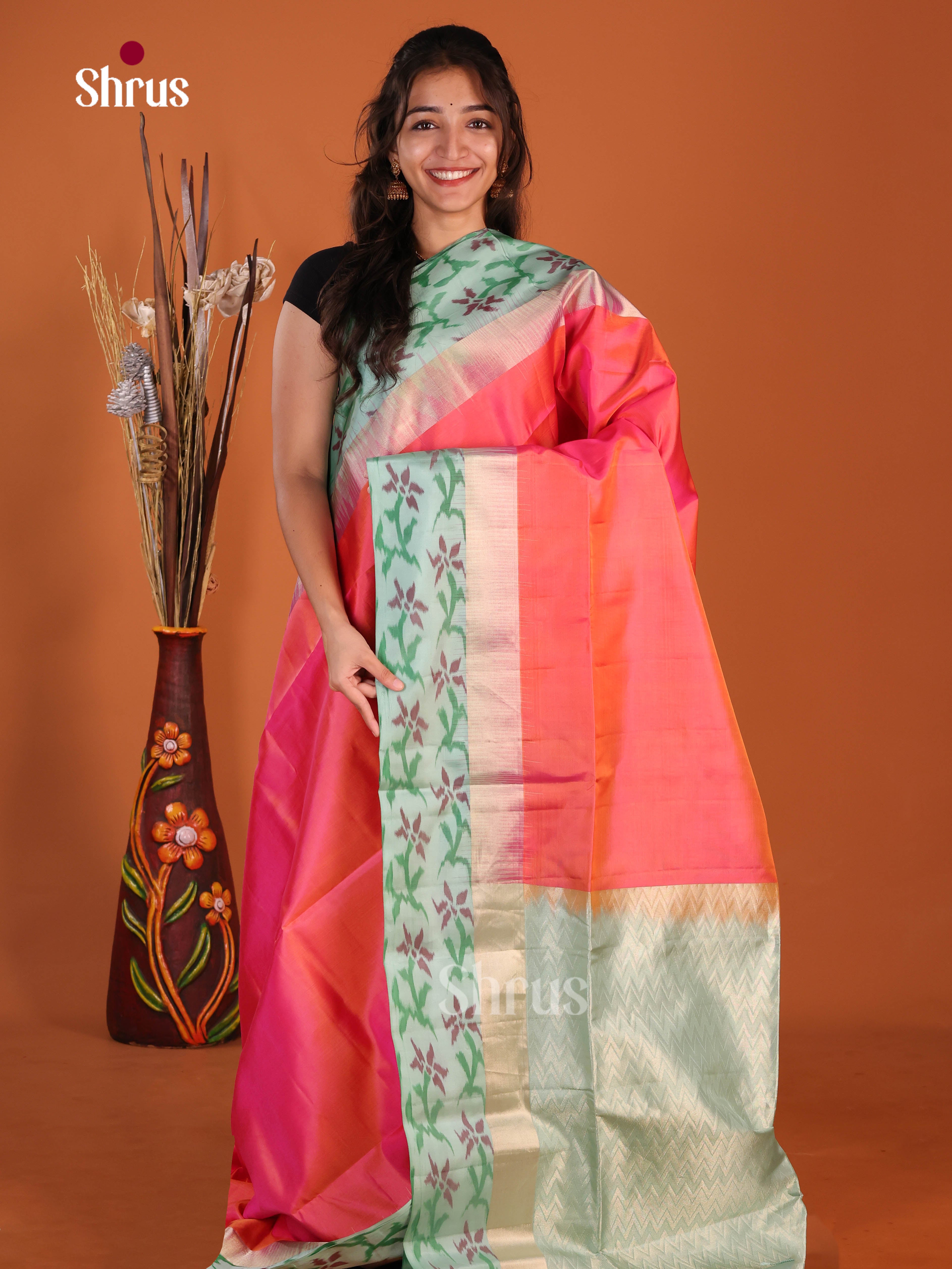 Stunning Orangish Pink Soft Silk Saree with mint green pochampally floral border