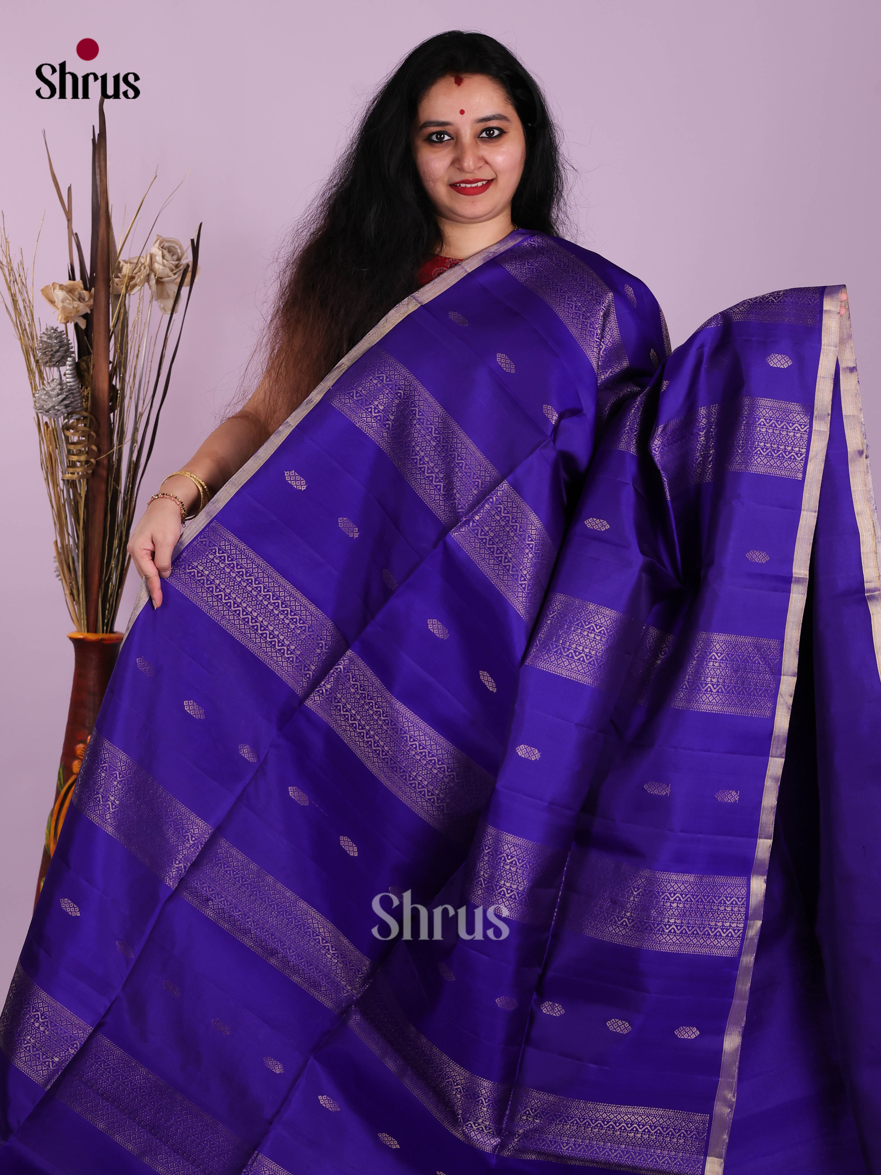 Majestic Blue single Tone Soft Silk Saree gleams with zari buttas , zari strapes
