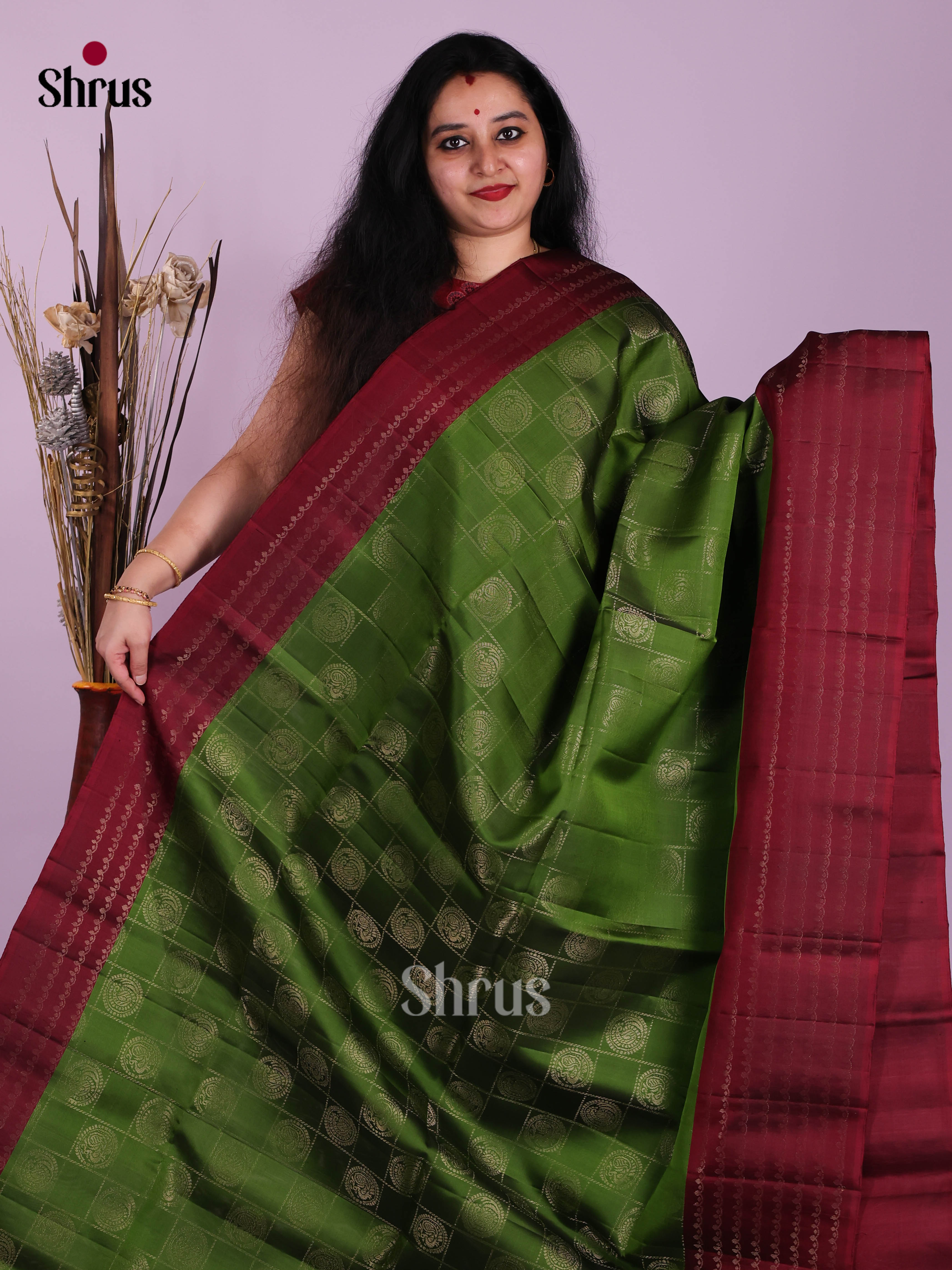 Ethereal Green & Maroon Soft Silk Saree dazzles with zari checks, peacock motifs - Shop on Shrus.com