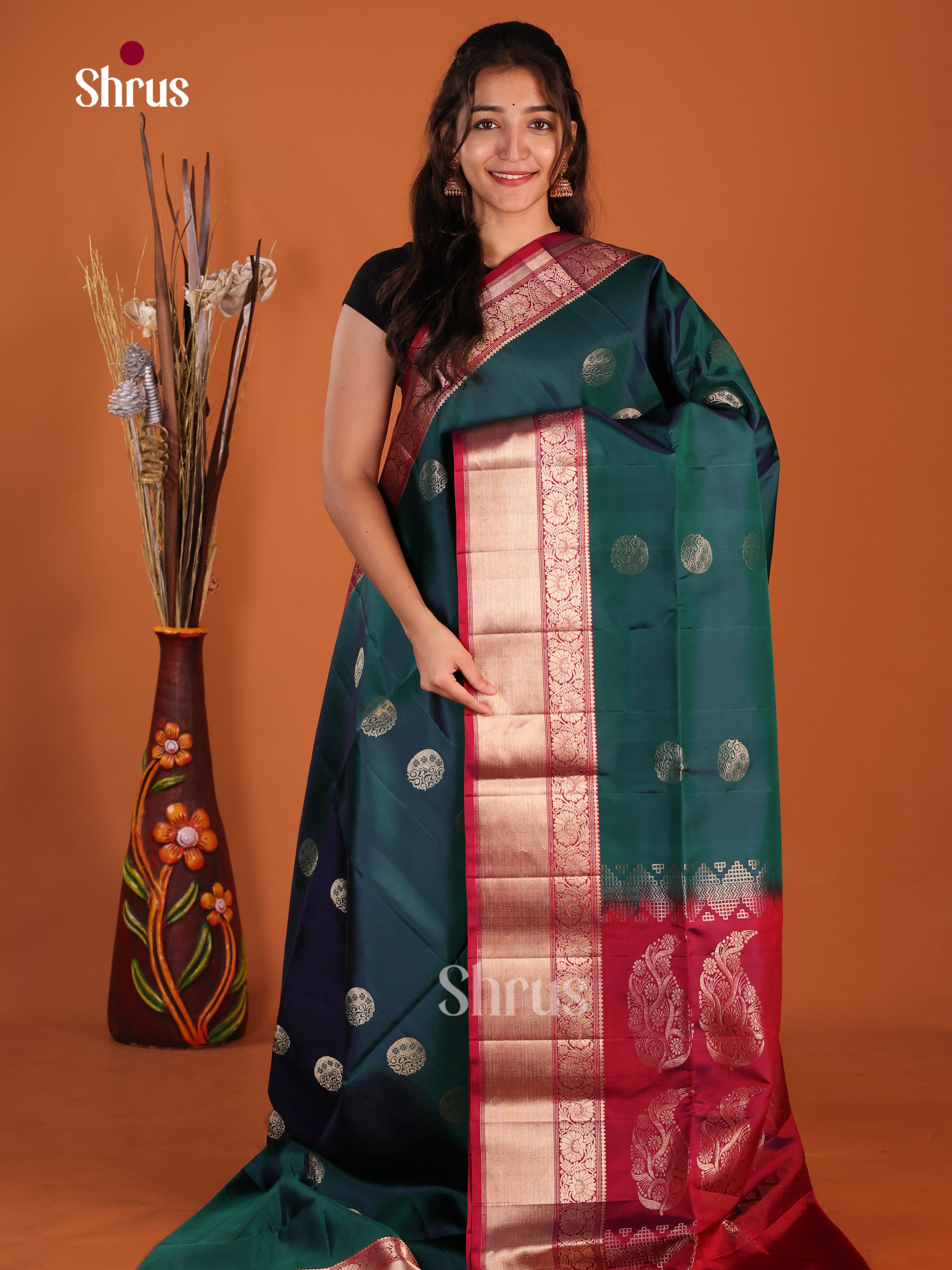 Enchanting Peacock Green & Maroon Soft Silk Saree with rich traditional zari border