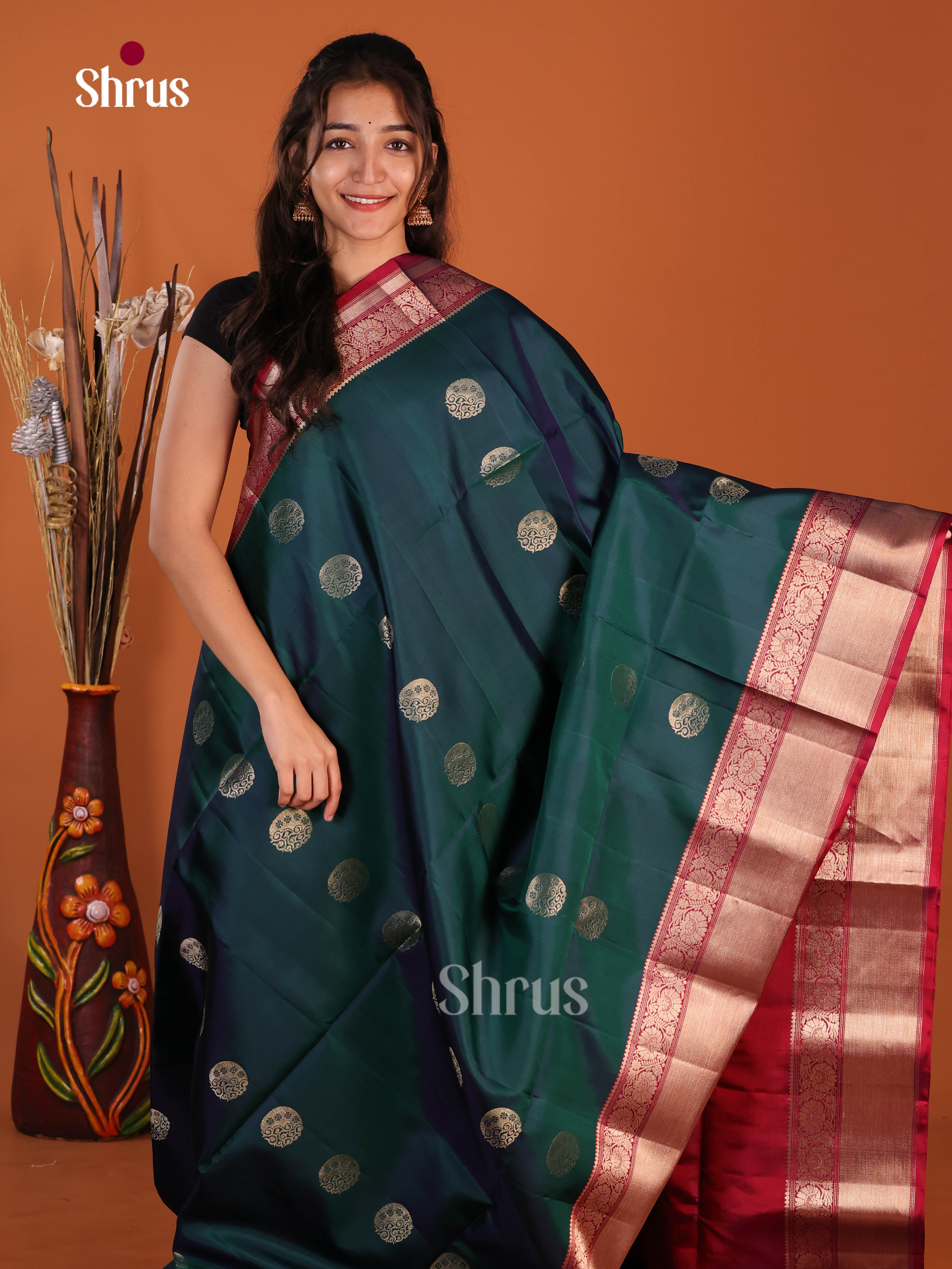 Enchanting Peacock Green & Maroon Soft Silk Saree with rich traditional zari border