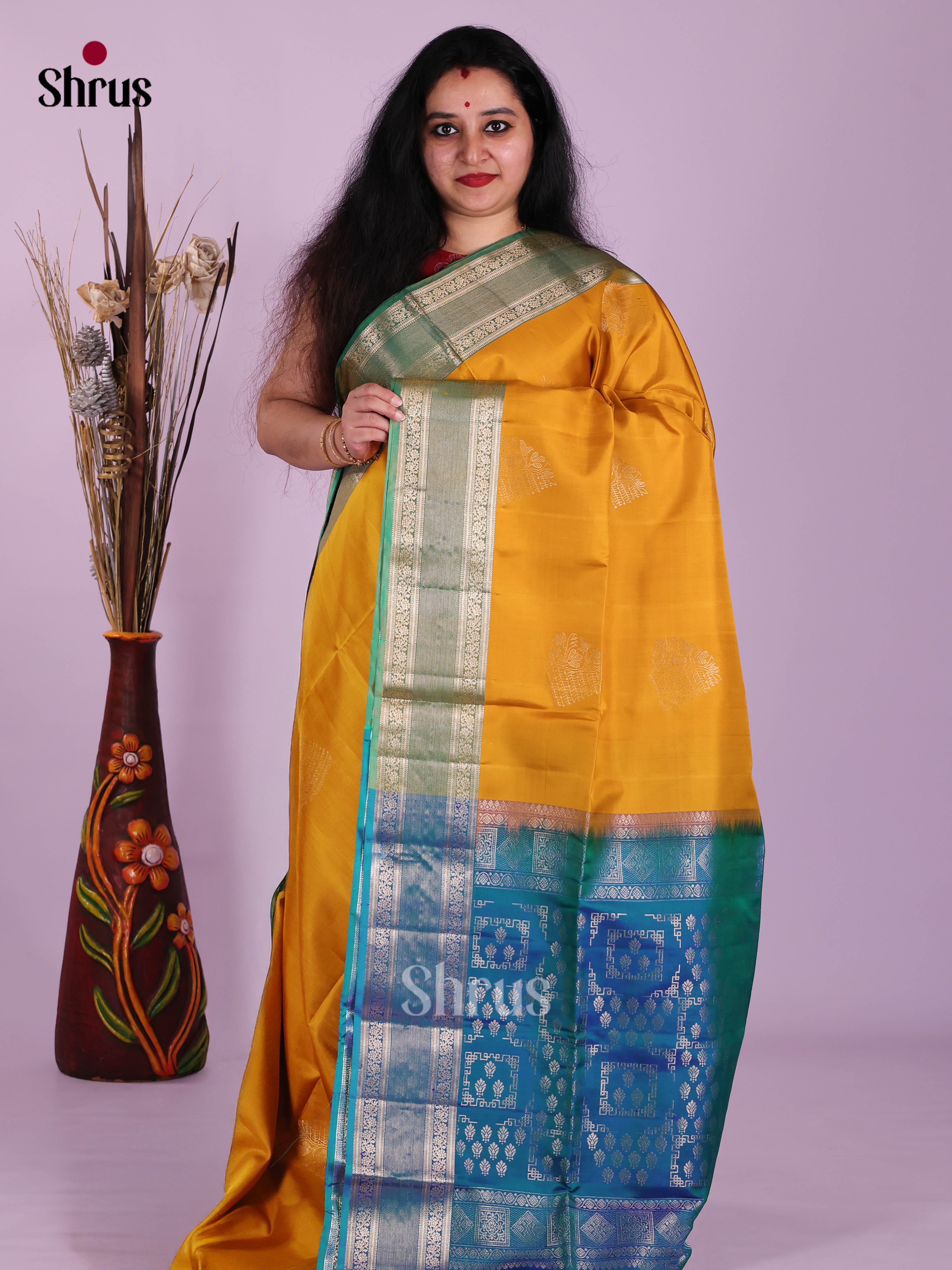 Glorious Mambazha Yellow & Blue Soft Silk Saree gleams with zari floral motifs - Shop on Shrus.com