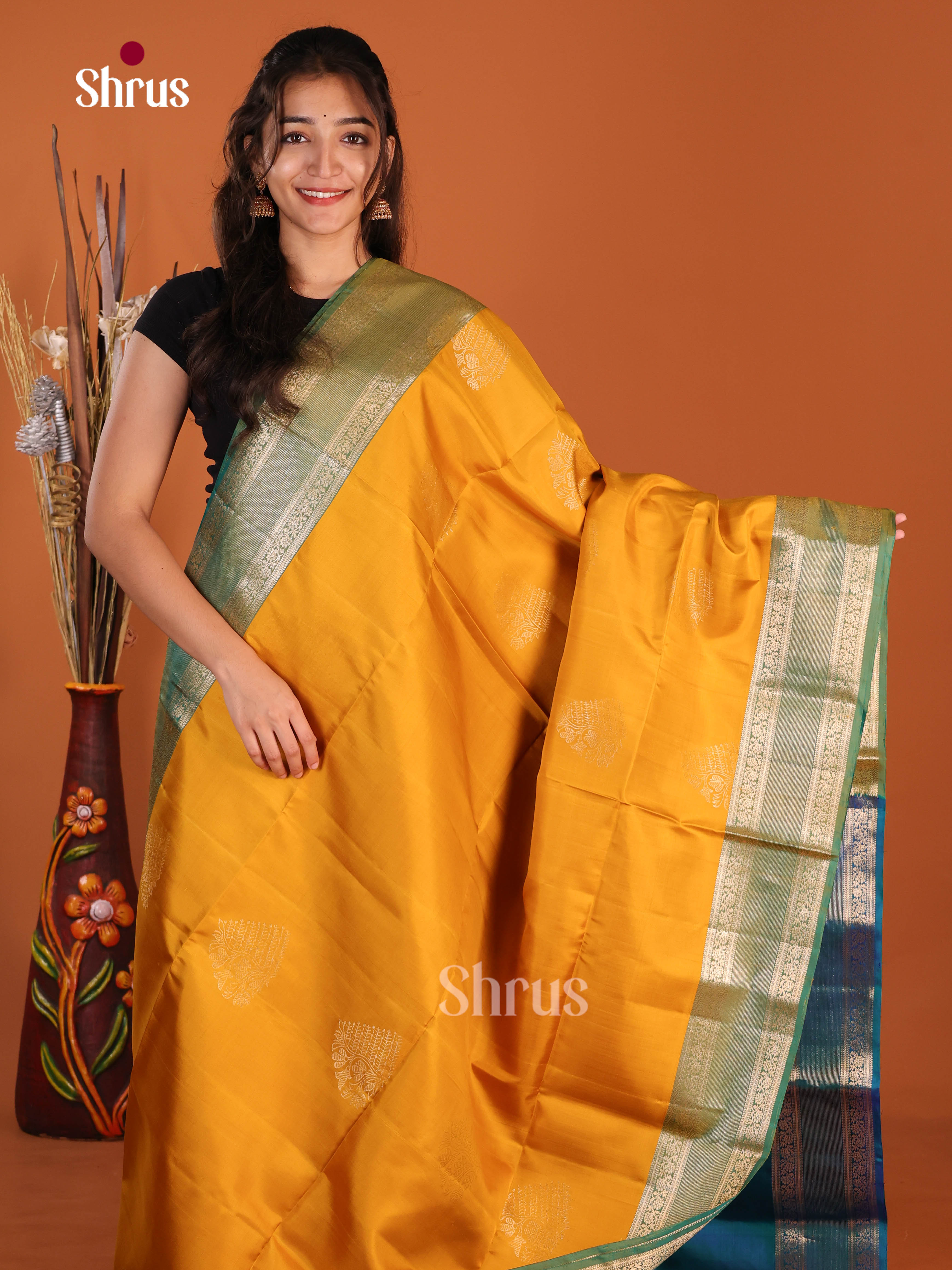 Glorious Mambazha Yellow & Blue Soft Silk Saree gleams with zari floral motifs - Shop on Shrus.com