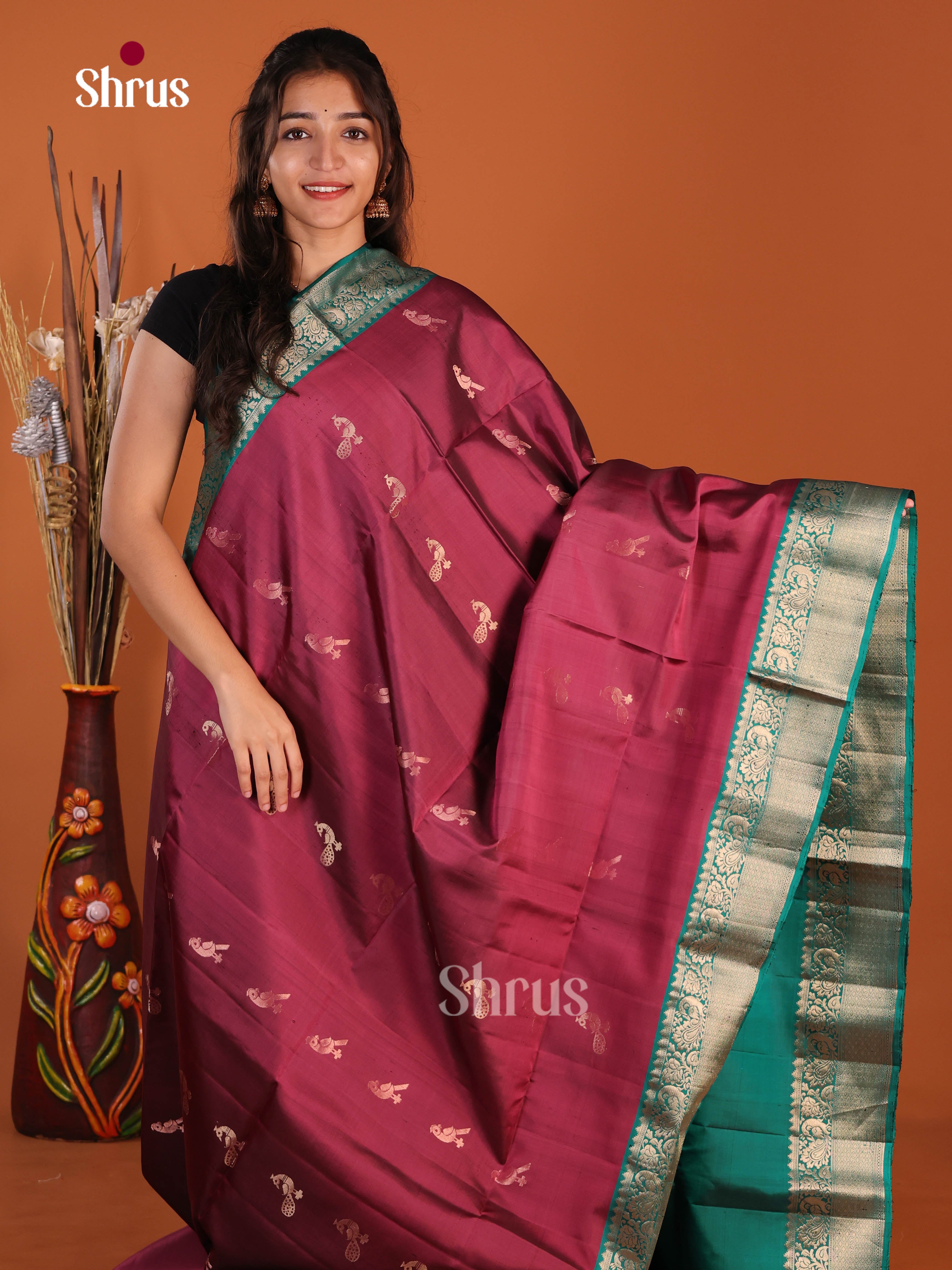 Graceful Maroon & Green Soft Silk Saree glemas with zari peacock buttas, brocade pallu