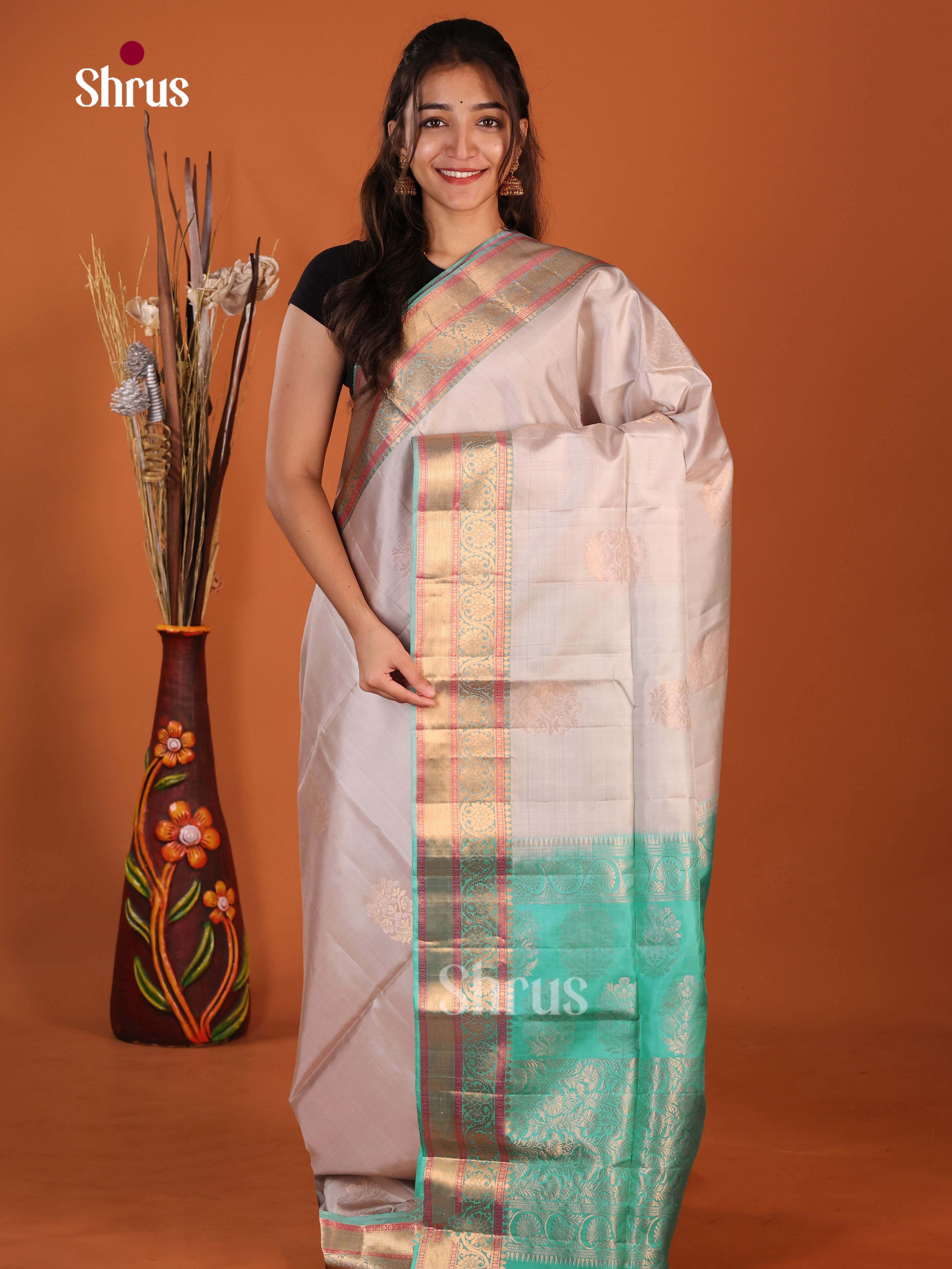 Lavish Grey & Green Soft Silk Saree with zari floral motifs , traditional zari border