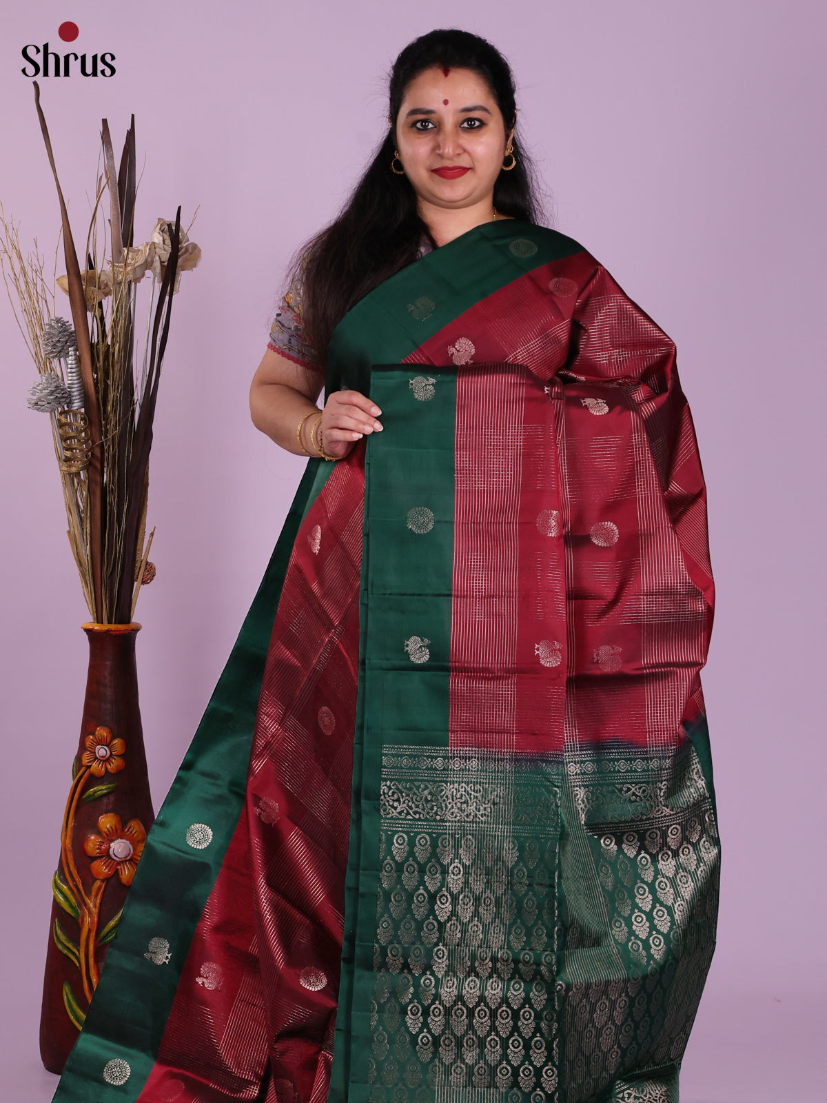 Lustrous Maroon & Green Soft Silk Saree with zari checks, peacock buttas