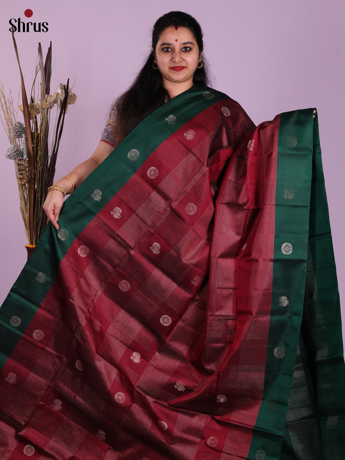Lustrous Maroon & Green Soft Silk Saree with zari checks, peacock buttas