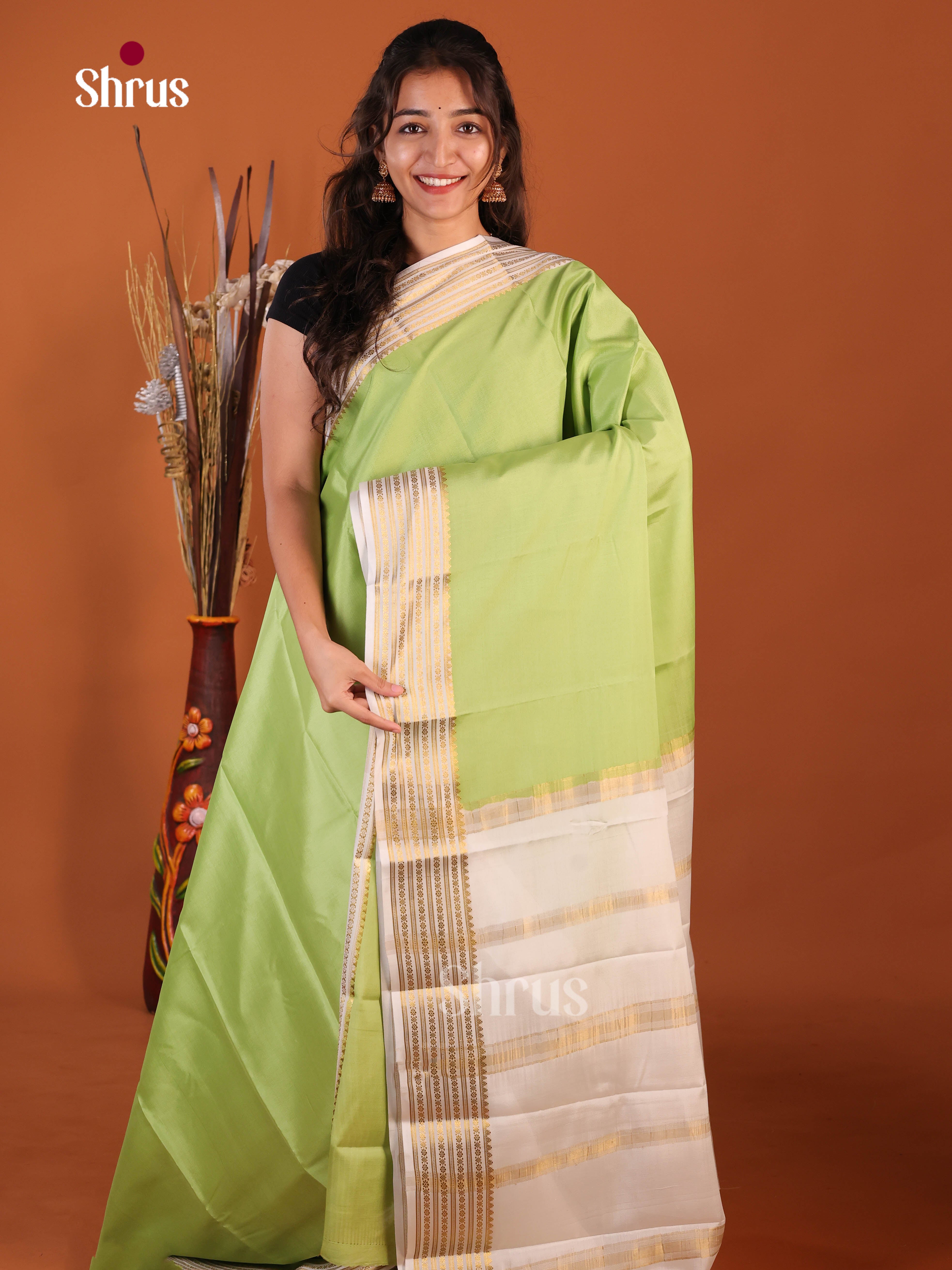 Charming Pista Green & Grey Mysore Silk Saree with traditional zari stripes pallu