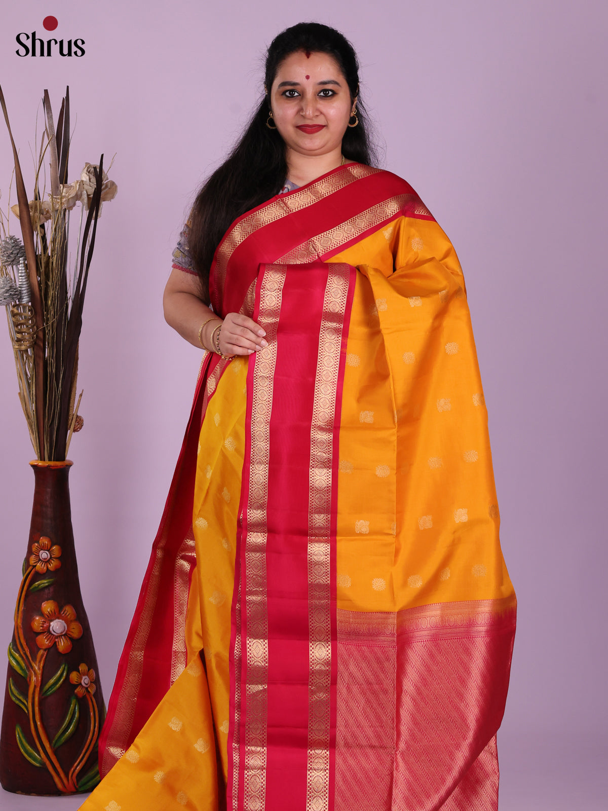 Luminous Yellow Soft Silk Saree With Golden Buttas & Red Rettaipet Zari Border