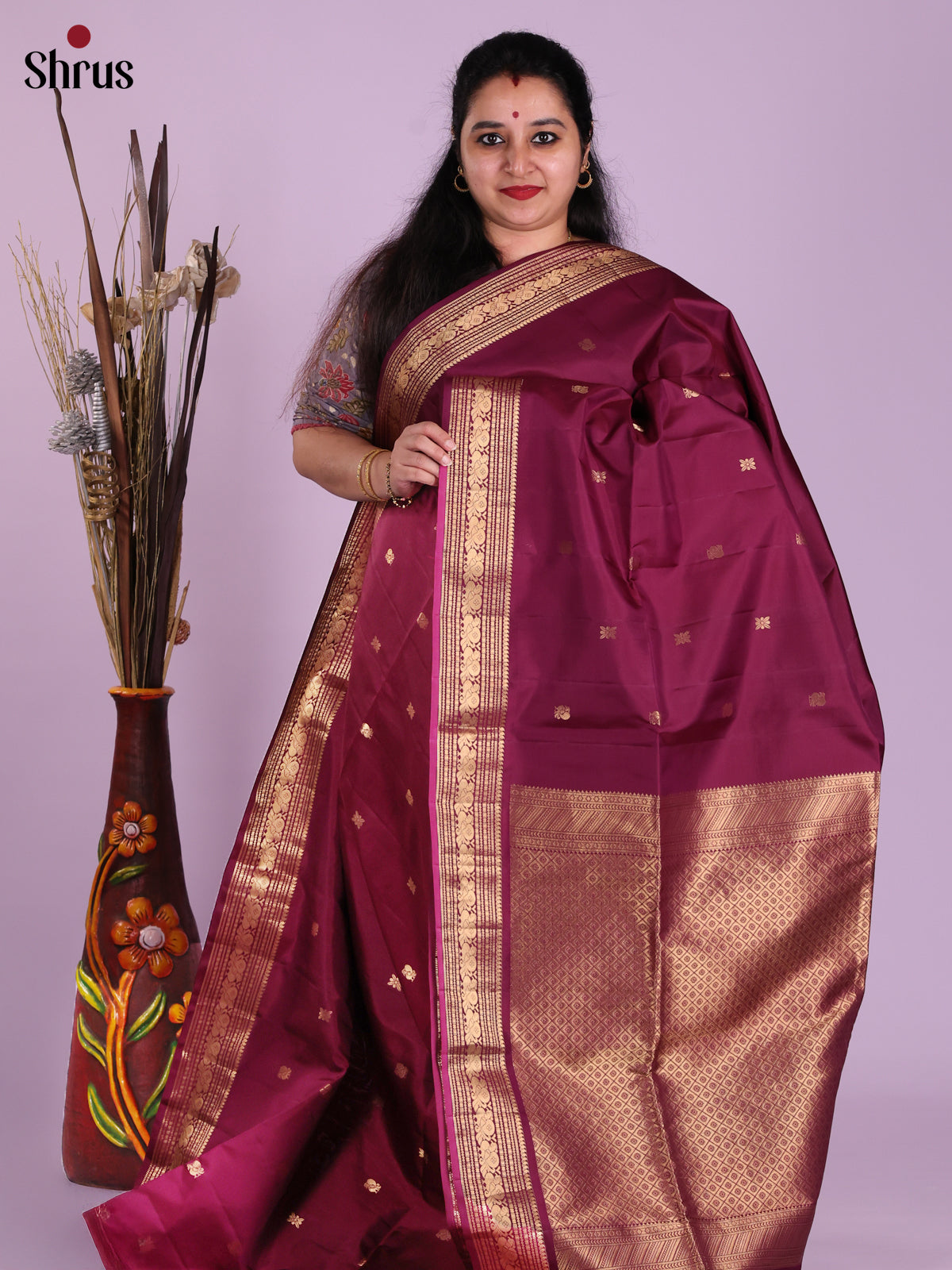 Graceful Maroon Monochrome Soft Silk Saree with gold zari peacock buttas